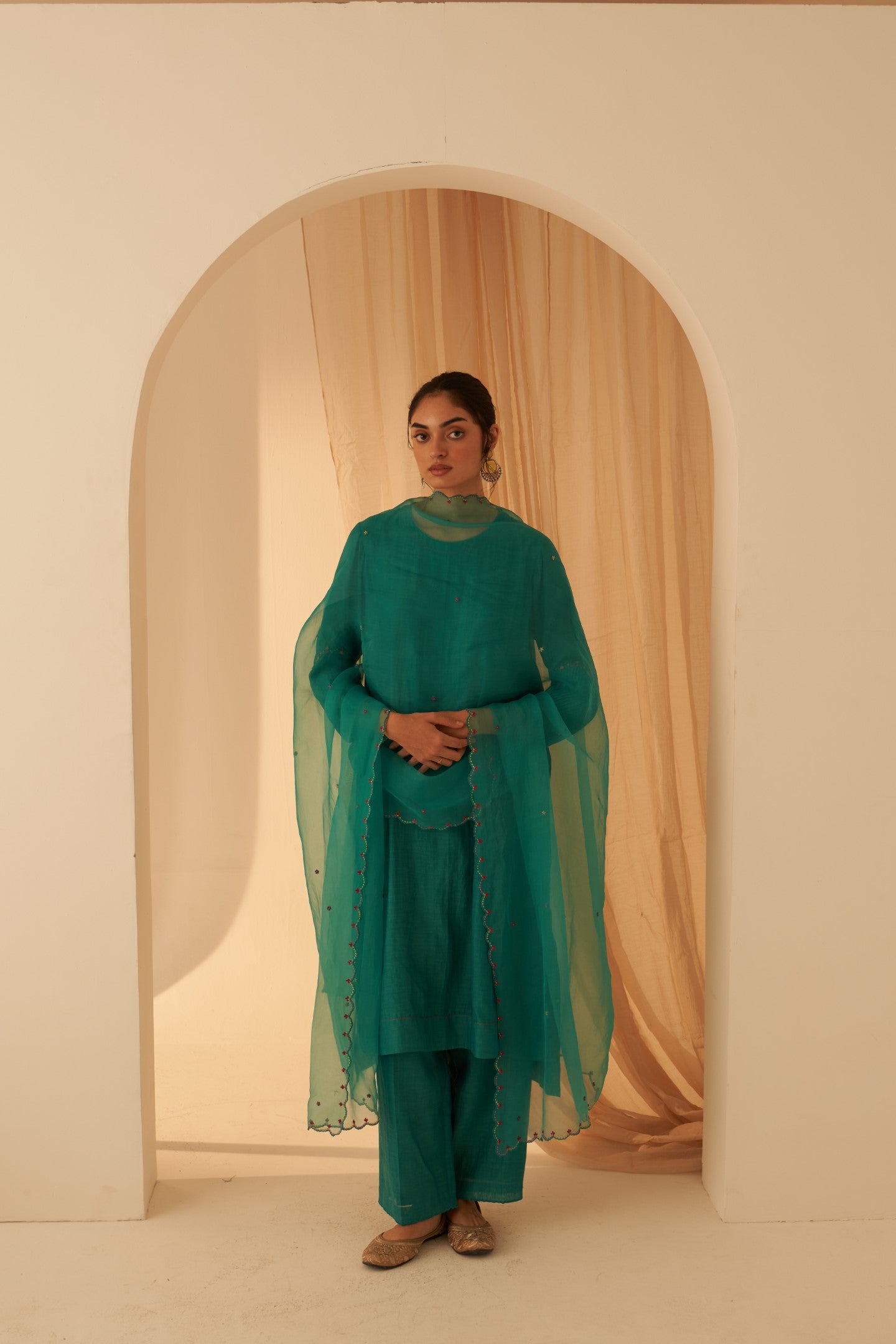 Turquoise chanderi kurta with pintuck box pleats and floral work on sleeves  paired with pant & organza dupatta