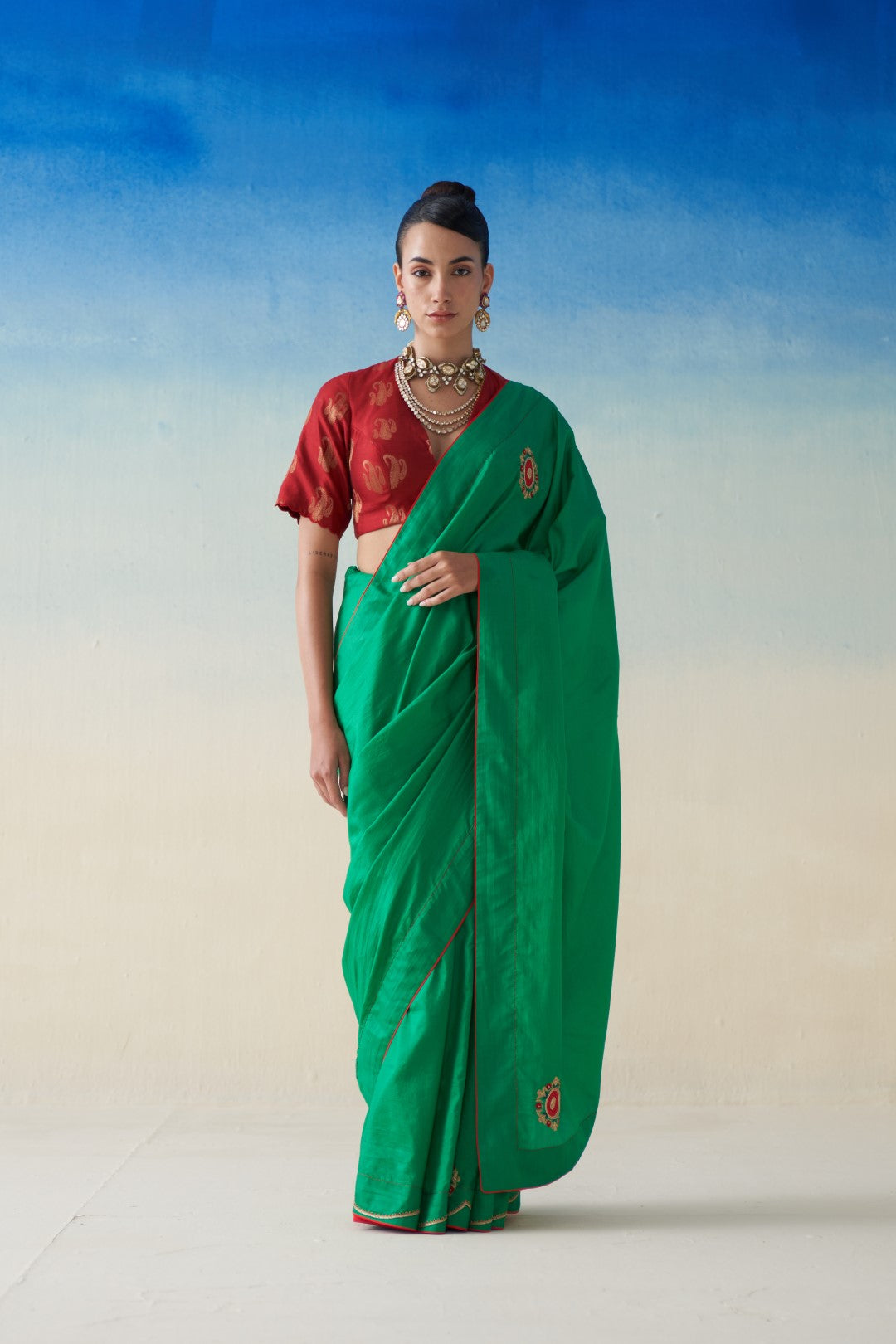 Green silk saree with embroidered motifs comes with an organic cotton stitched peticoat (02 Pcs.)