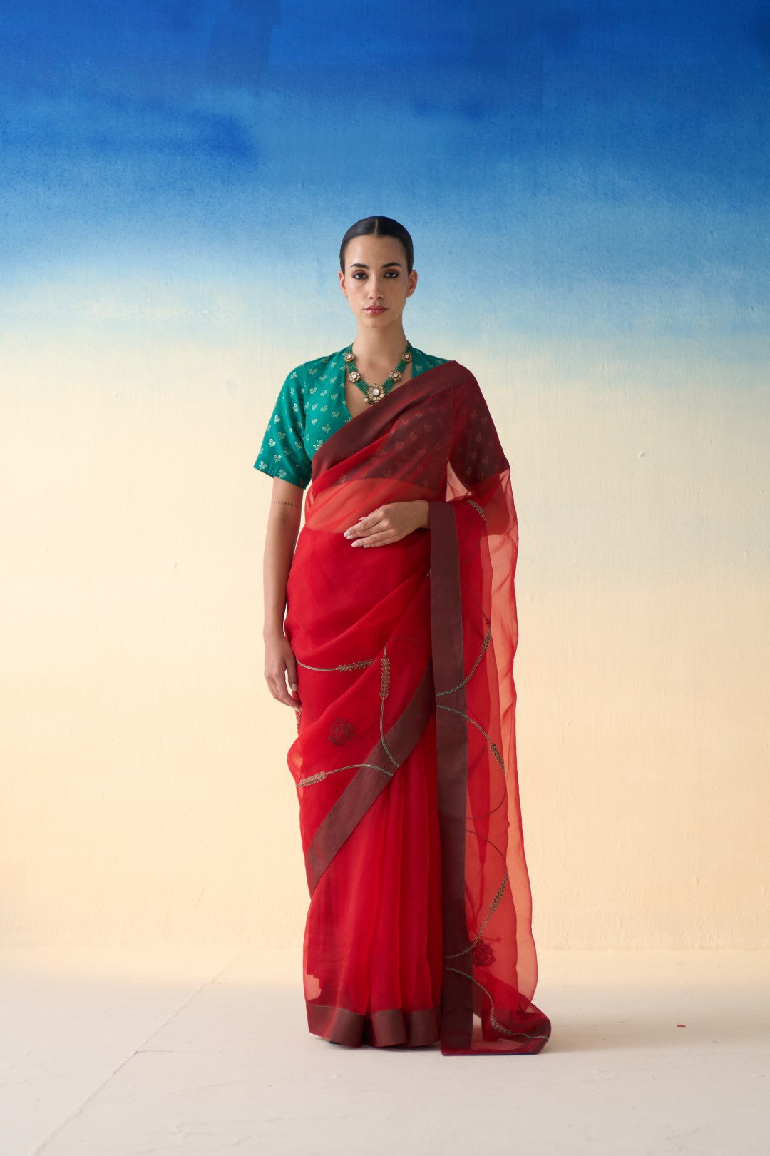 Red jaal embroidered organza saree comes with an organic cotton petticoat (02 Pcs.)