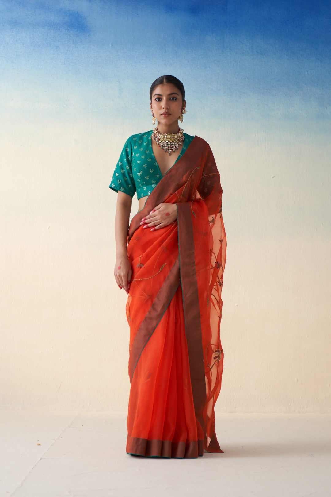 Rust jaal embroidered saree in organza comes with an organic cotton stitched petticoat (02 Pcs.)