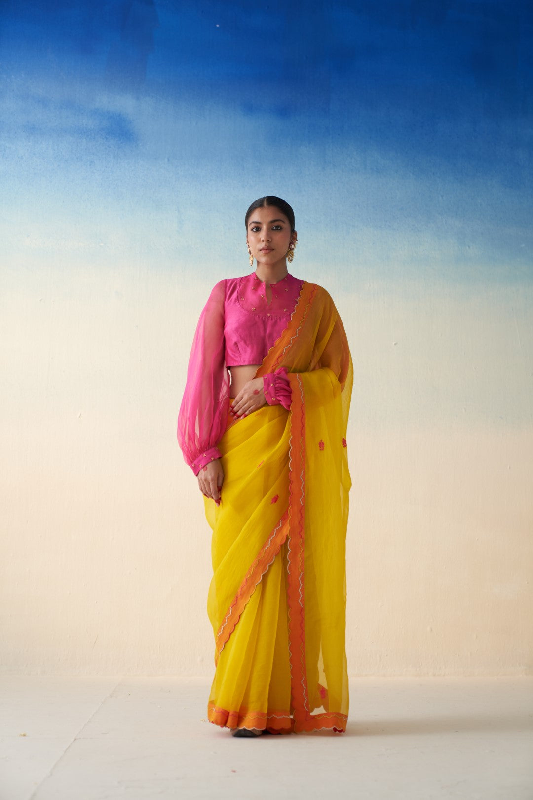 Yellow organza embroidered  scallop border saree comes with an organic cotton stitched petticoat (02 Pcs.)