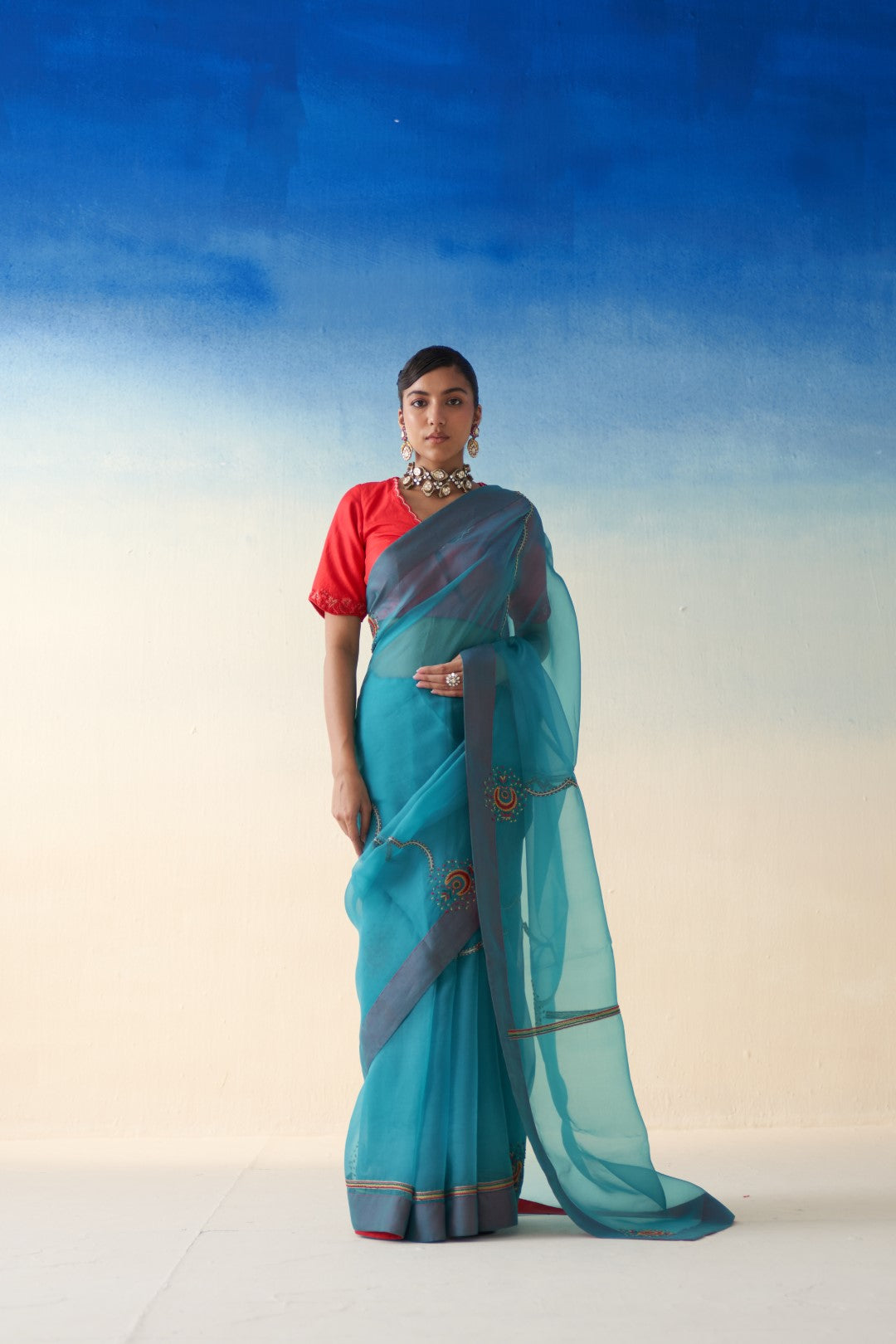 Turquoise organza embroidered saree comes with an organic cotton stitched petticoat (02 Pcs.)