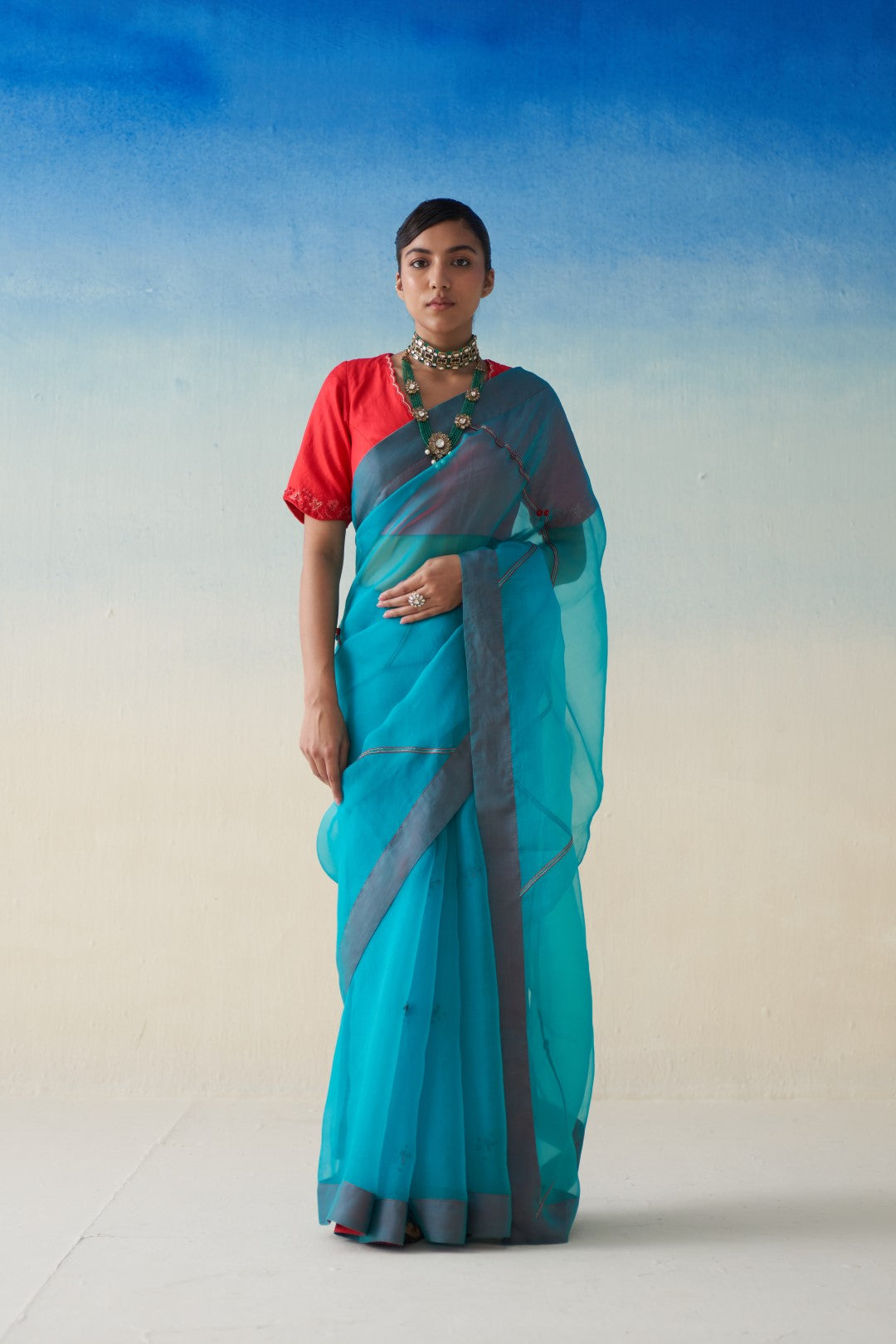 Turquoise  organza  embroidered saree comes with an organic cotton stitched petticoat (02 Pcs.)