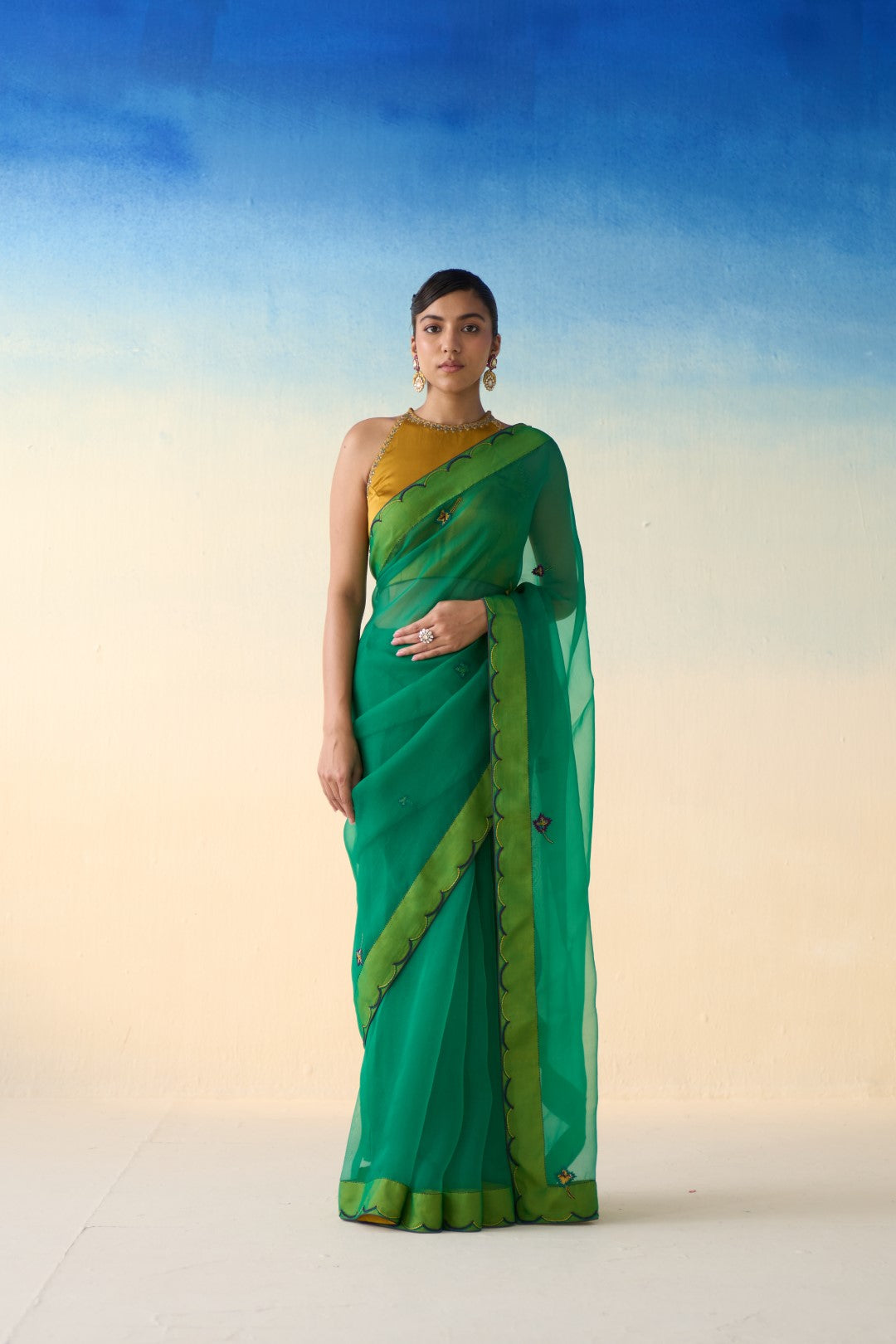 Green organza embroidered & scallop border saree comes with an organic cotton  petticoat. (02 Pcs.)