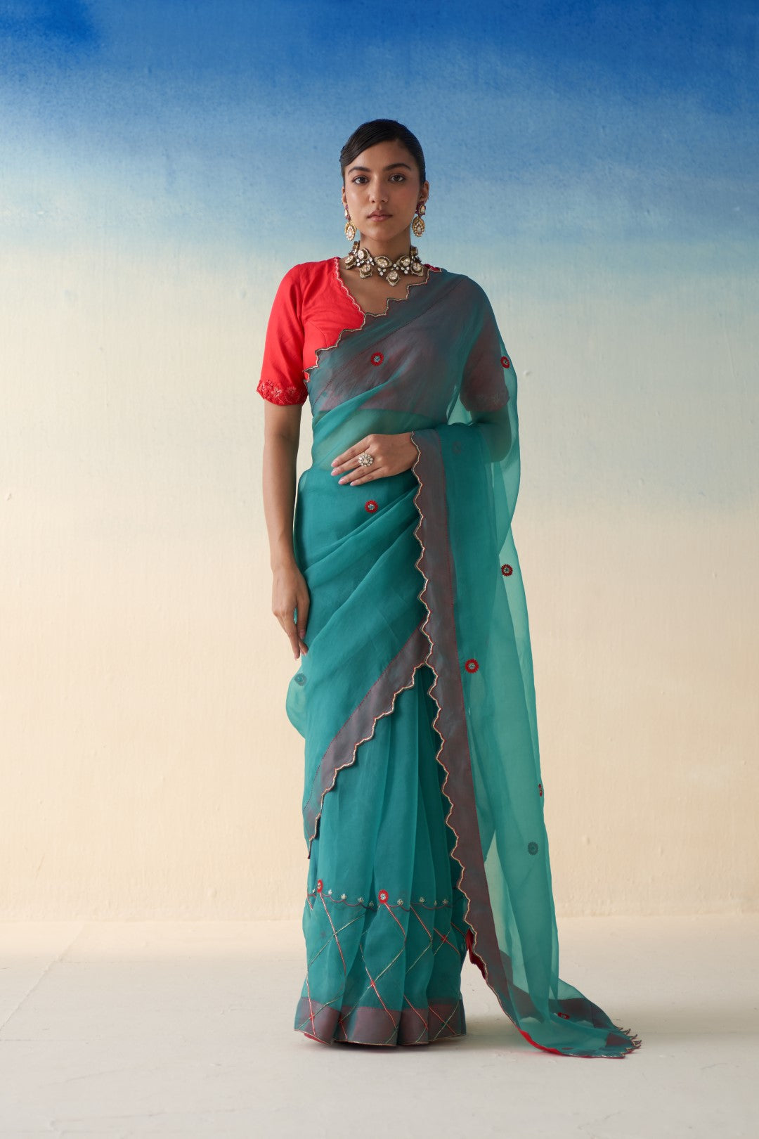 Turquoise organza checkered jaal-embroidered saree comes  with an organic cotton stitched petticoat (02 Pcs.)