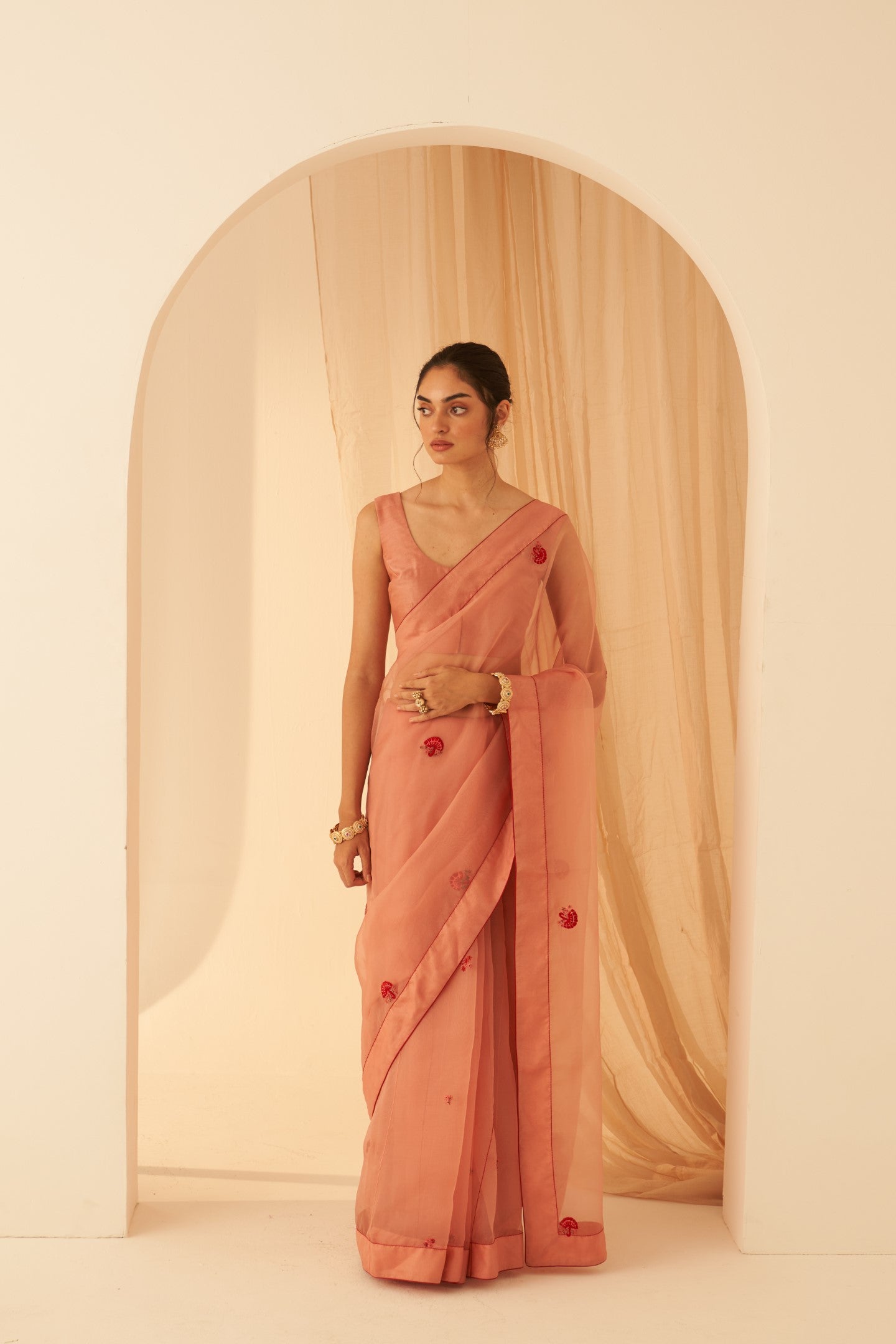 Peach organza thread zardozi hand embroidered saree paired with an organic cotton stitched petticoat