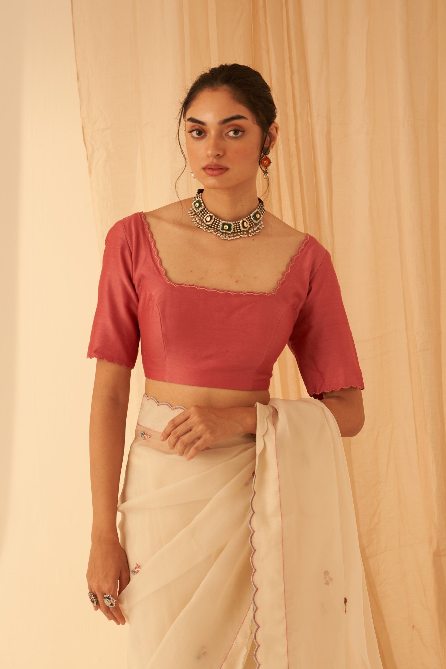 Pink chanderi  blouse with scallop work on necline and sleeves edges