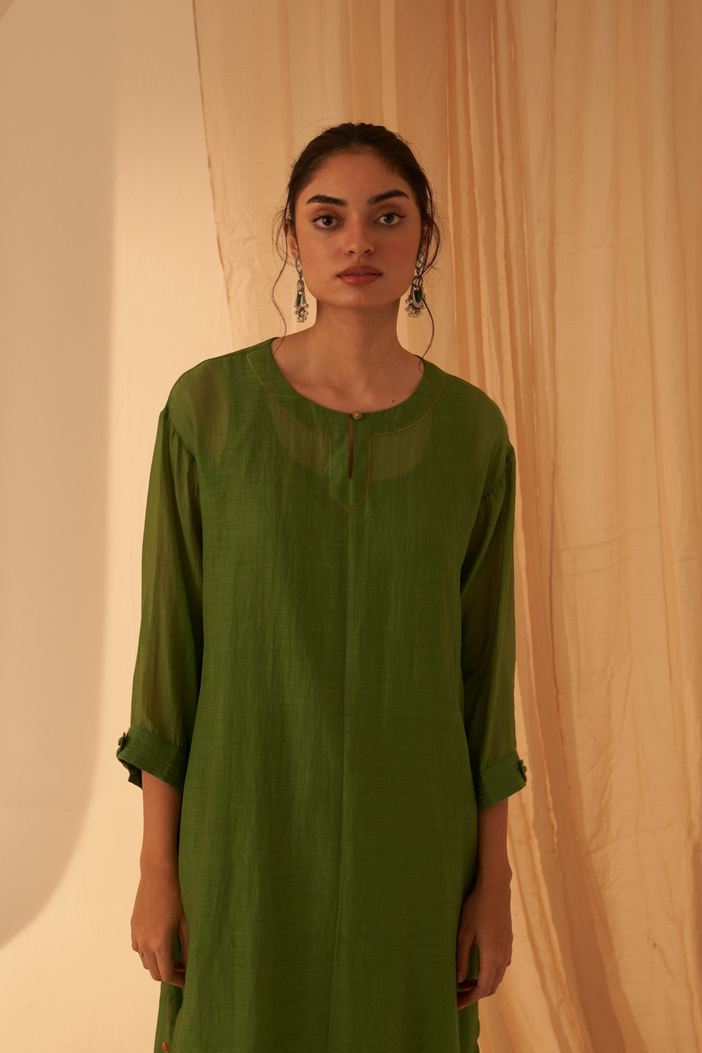 Green chanderi cross taanka emdroidered kurta paired with cotton slip, pant & chanderi dupatta