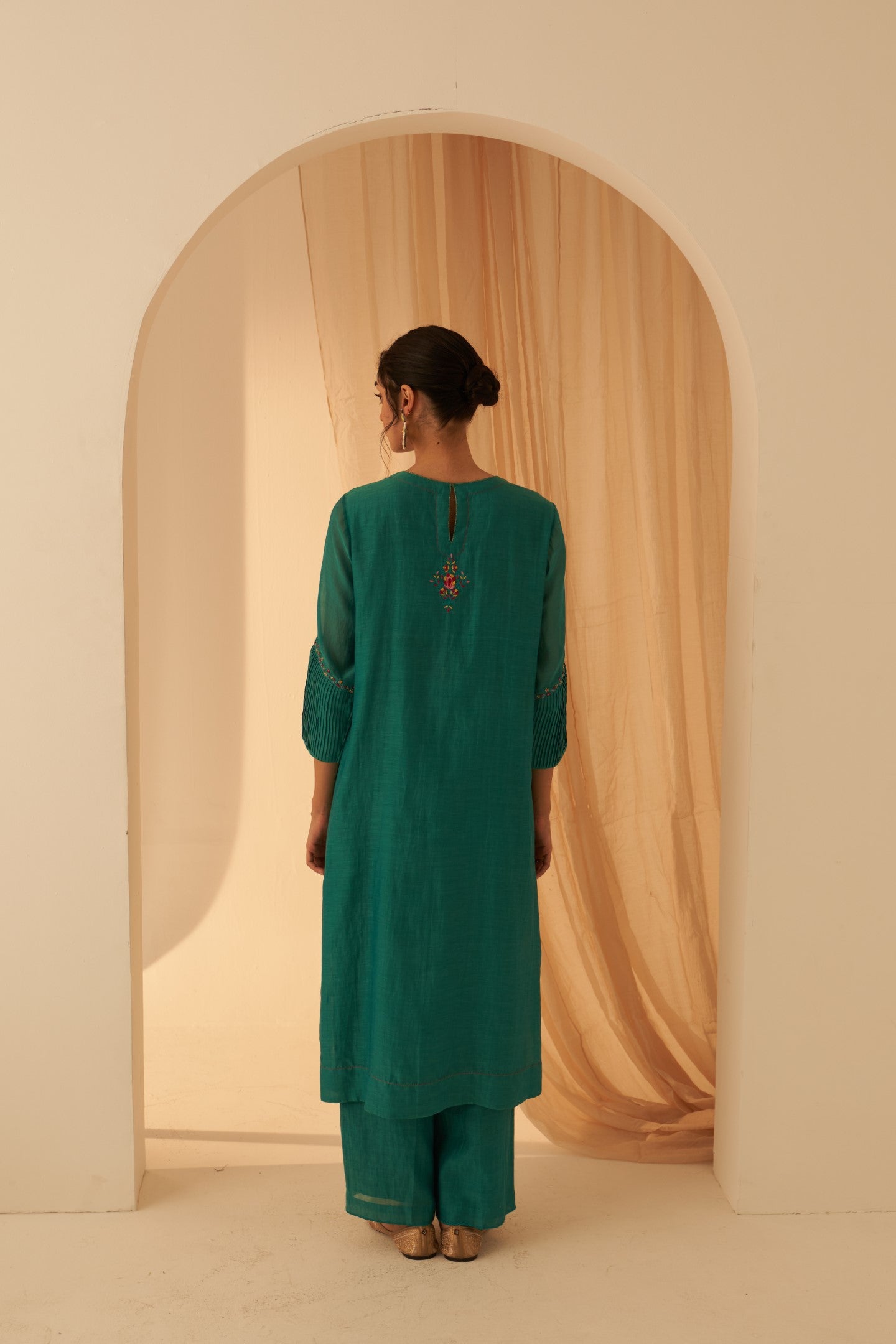 Turquoise chanderi kurta with pintuck box pleats and floral work on sleeves  paired with pant & organza dupatta