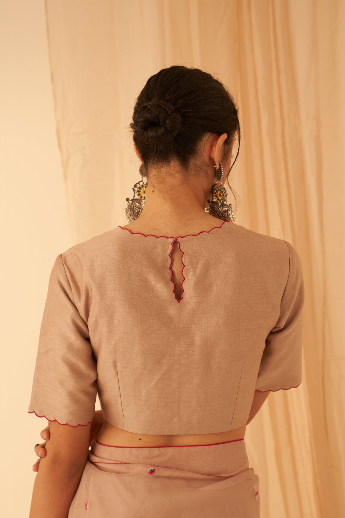 Light rose gold chanderi blouse woth scallop at neckline and sleeves edges