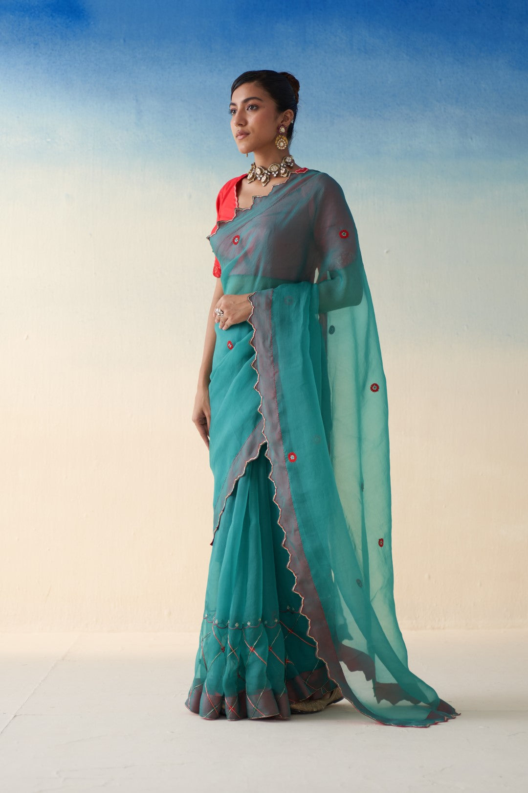 Turquoise organza checkered jaal-embroidered saree comes  with an organic cotton stitched petticoat (02 Pcs.)