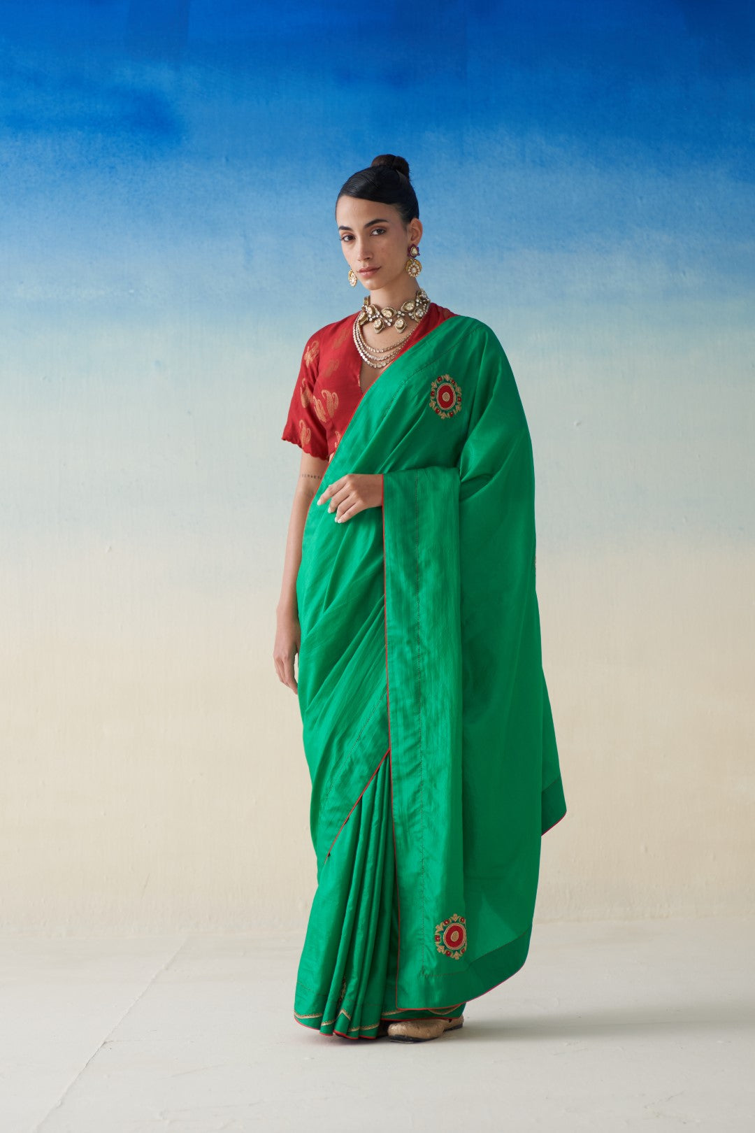 Green silk saree with embroidered motifs comes with an organic cotton stitched peticoat (02 Pcs.)