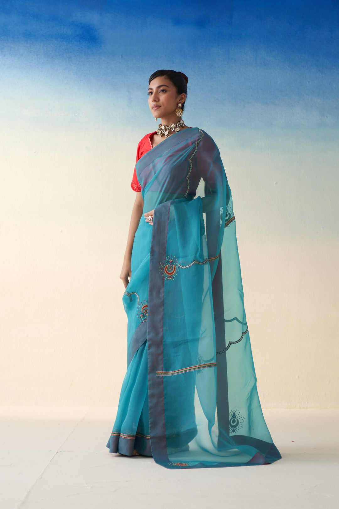 Turquoise organza embroidered saree comes with an organic cotton stitched petticoat (02 Pcs.)