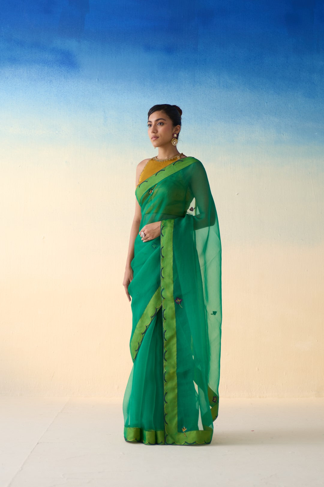 Green organza embroidered & scallop border saree comes with an organic cotton  petticoat. (02 Pcs.)