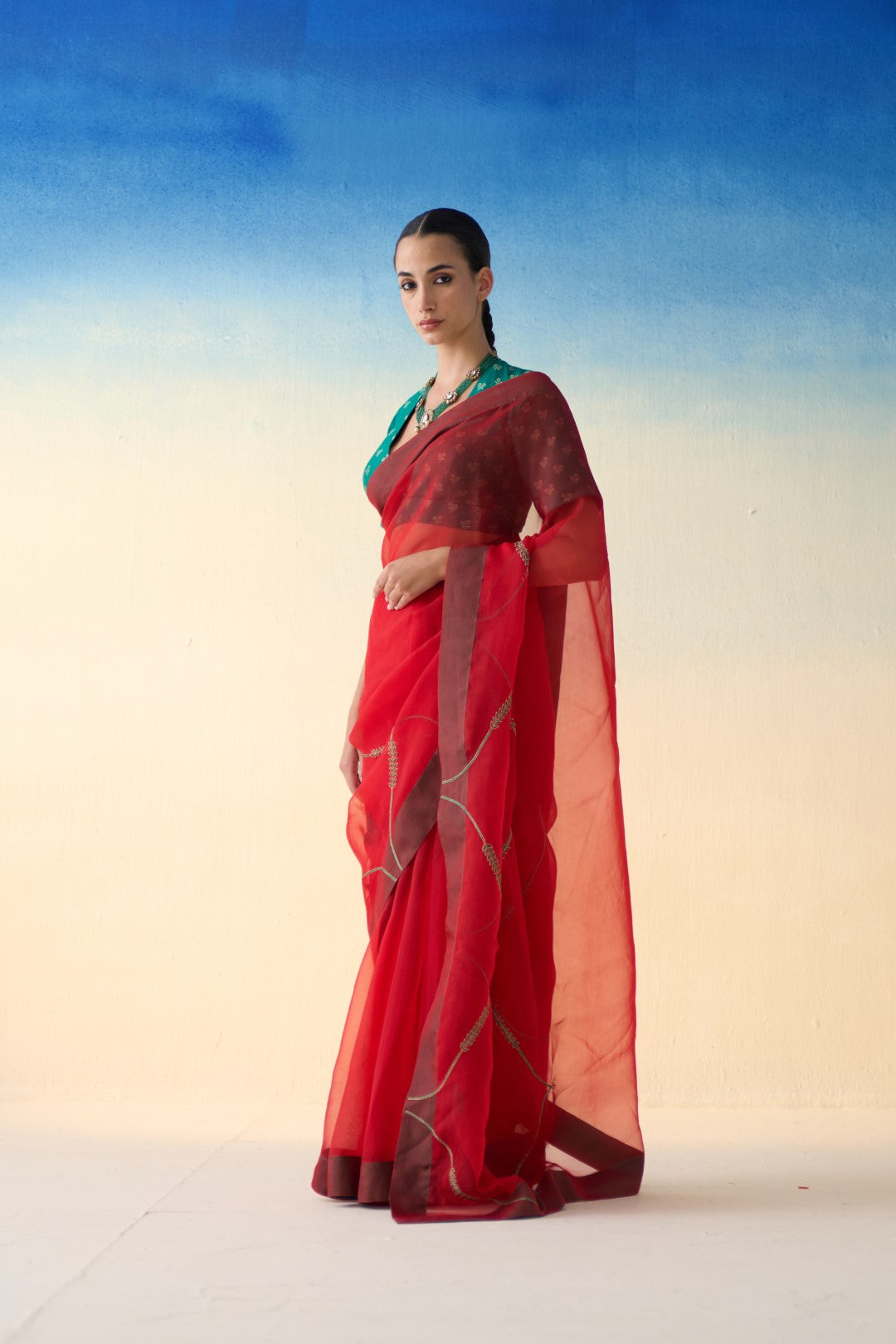 Red jaal embroidered organza saree comes with an organic cotton petticoat (02 Pcs.)