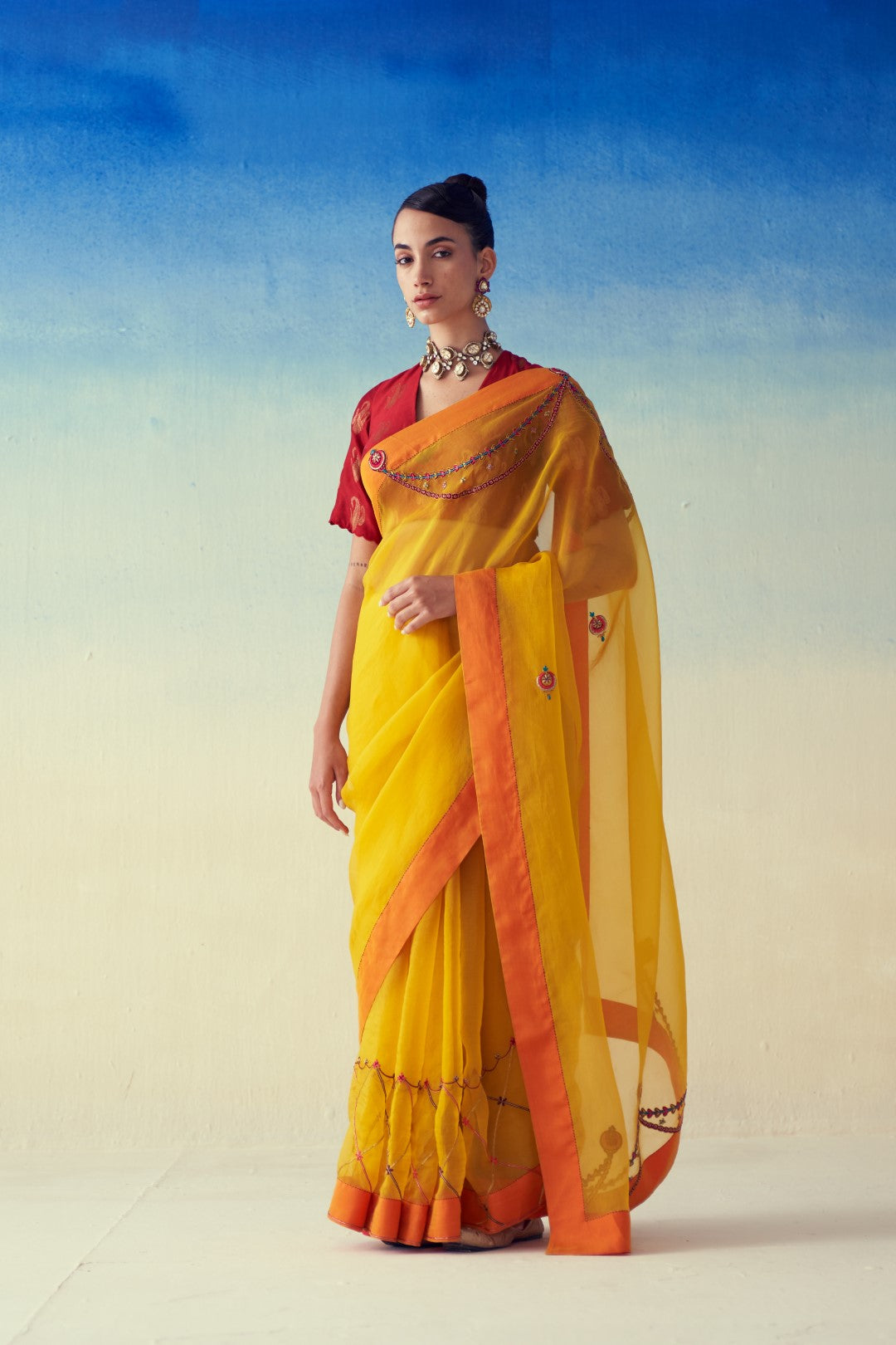 Yellow organza embroidered saree comes with an organic cotton  petticoat (02 Pcs.)