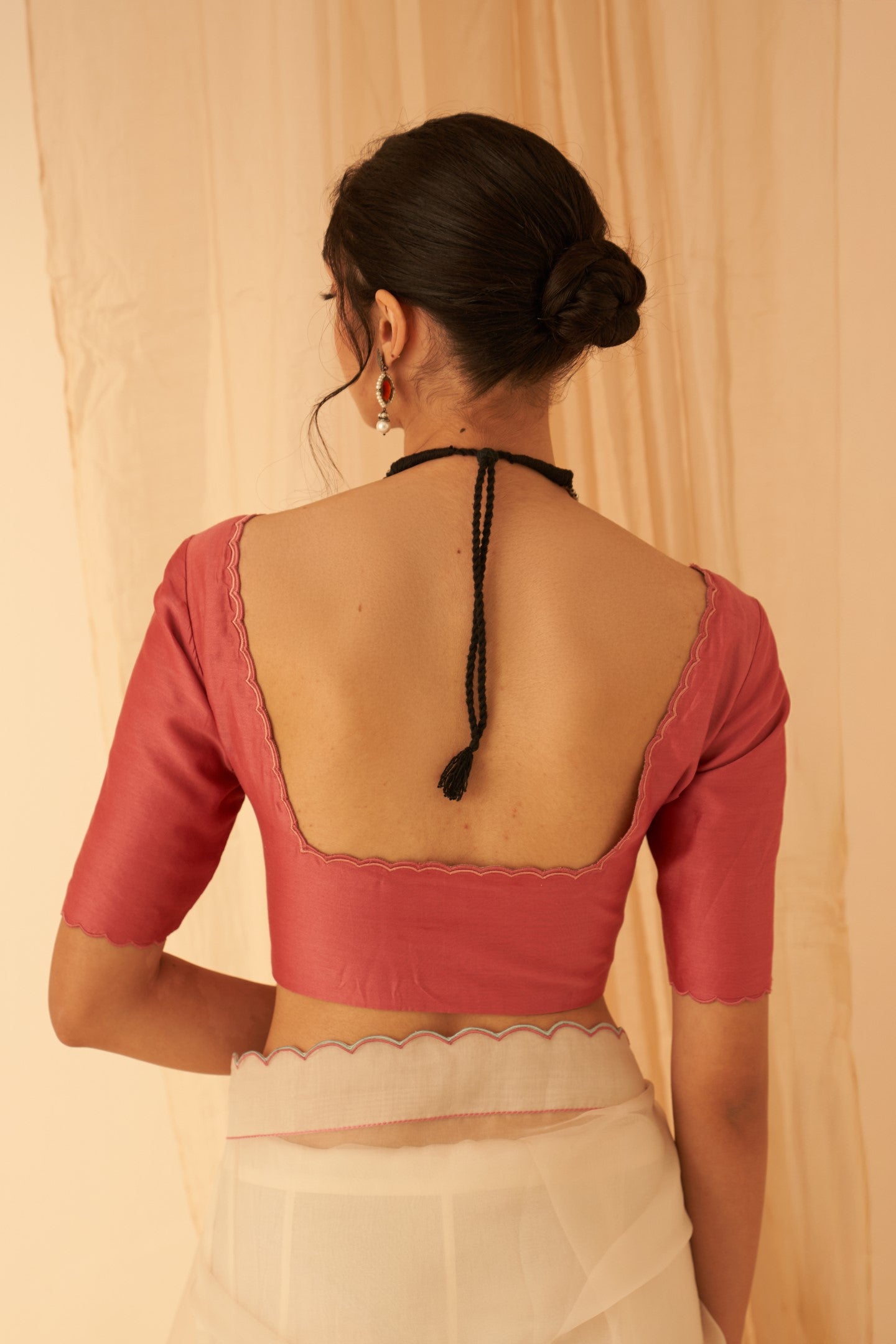 Pink chanderi  blouse with scallop work on necline and sleeves edges