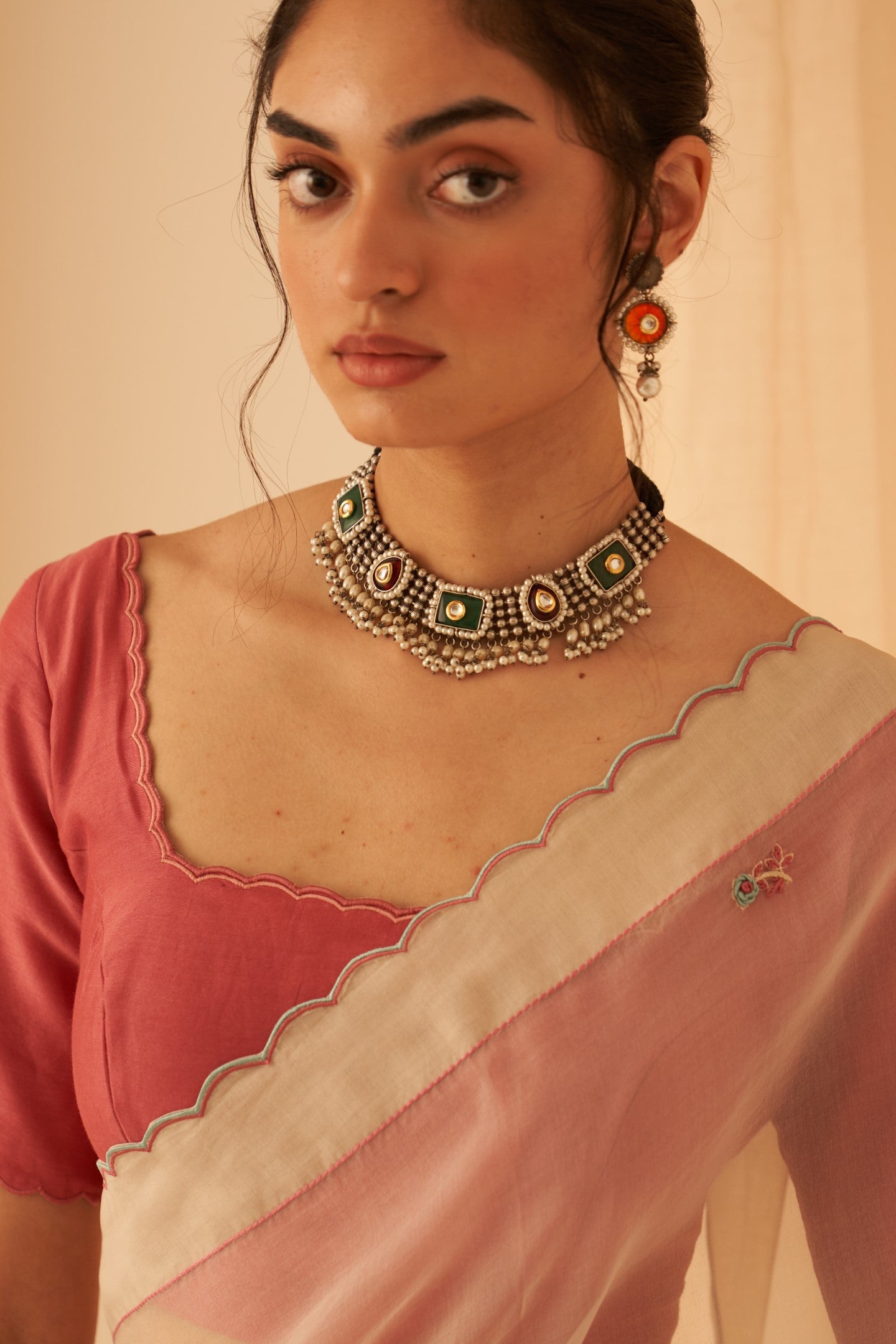 Pink chanderi  blouse with scallop work on necline and sleeves edges