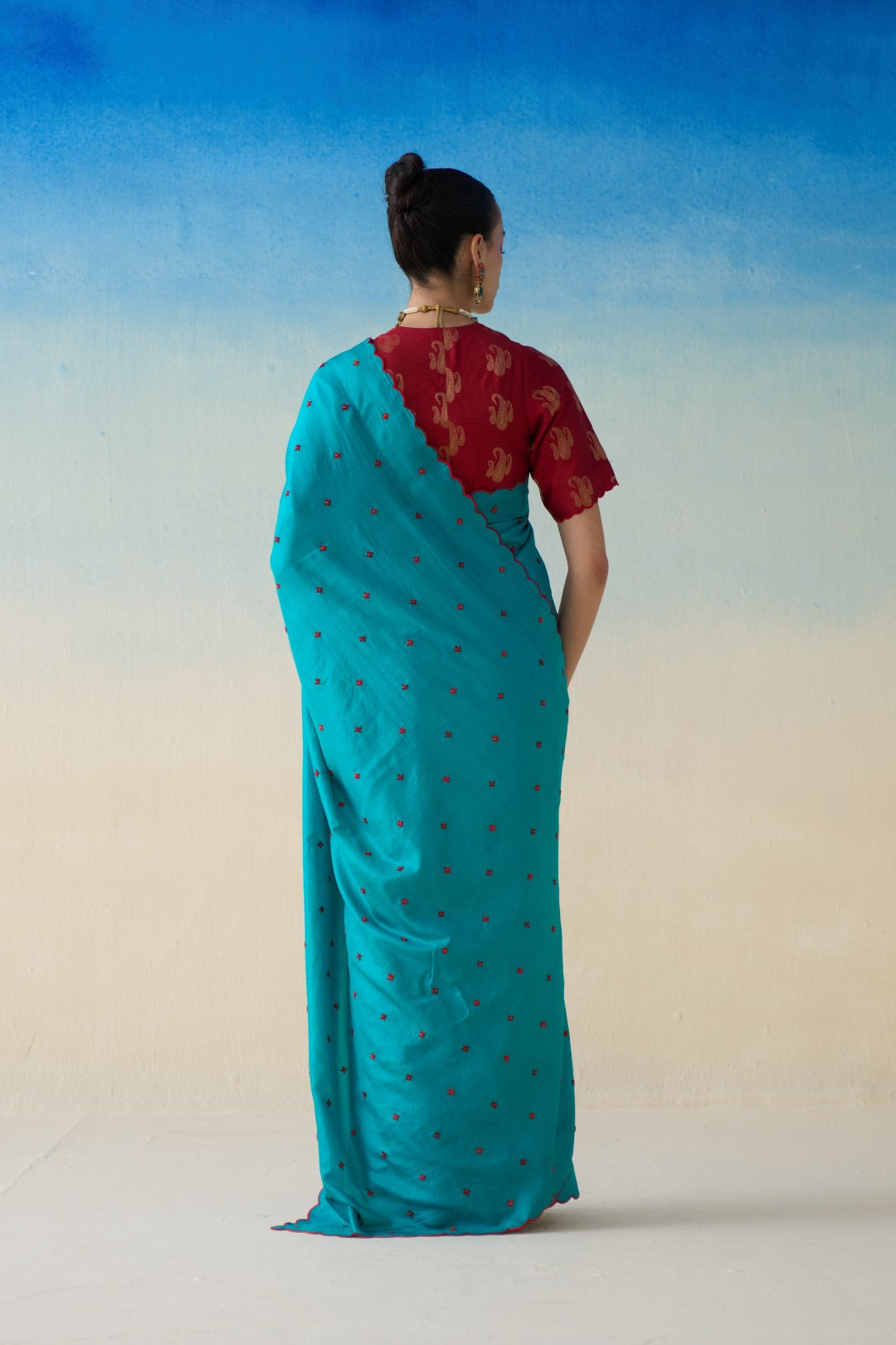 Turquoise silk embroidered saree comes with an organic cotton stitched petticoat ( 02 Pcs.)