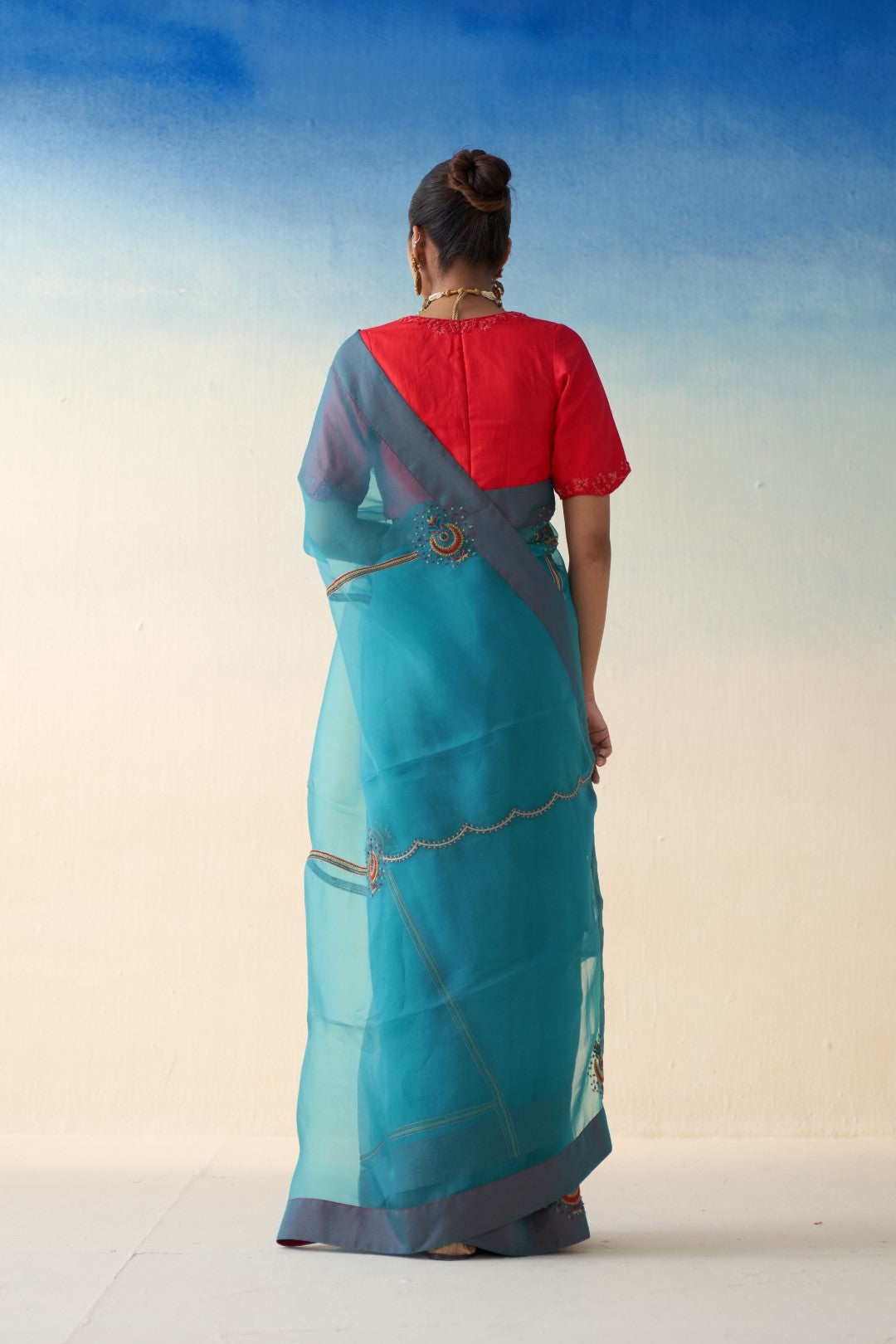 Turquoise organza embroidered saree comes with an organic cotton stitched petticoat (02 Pcs.)