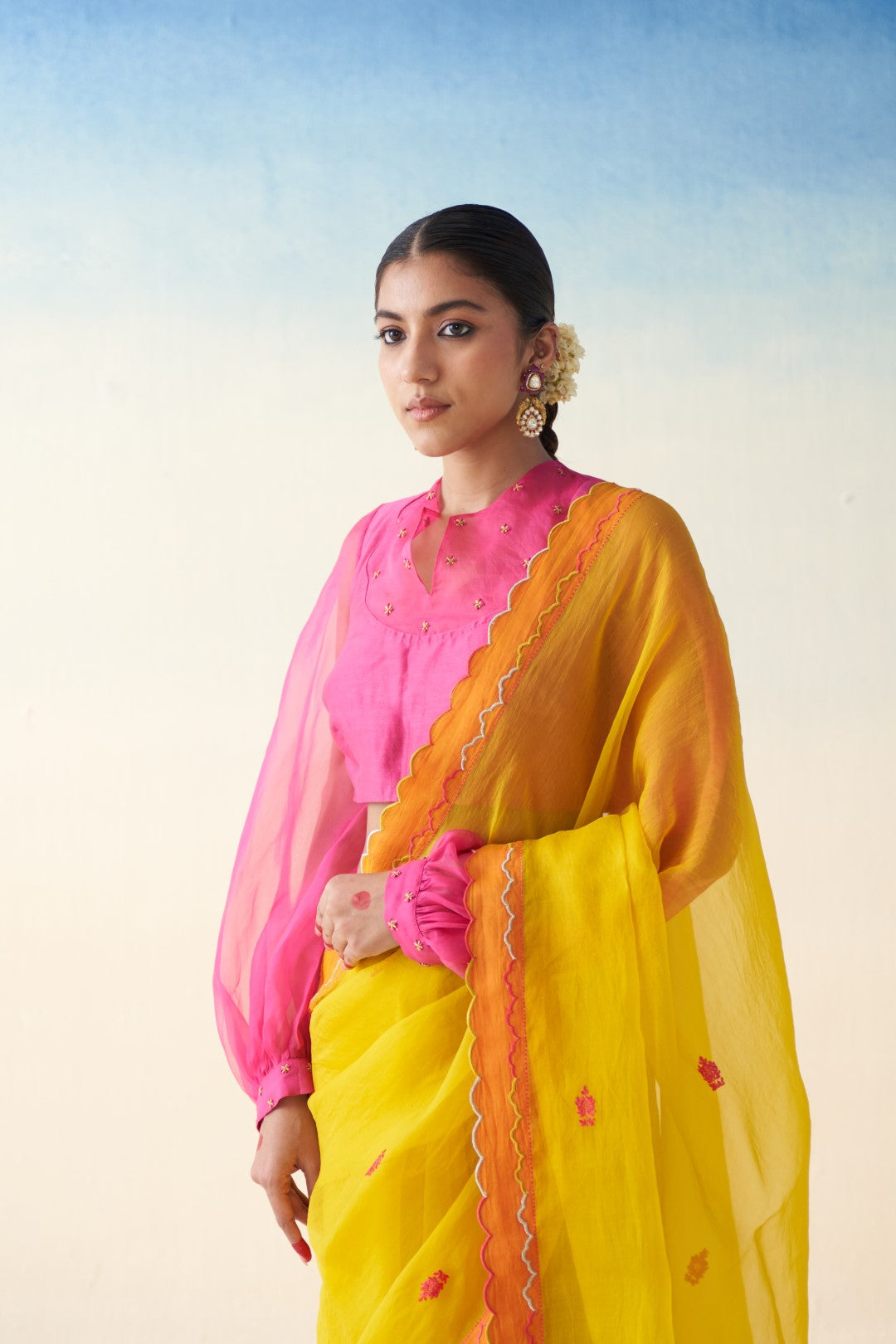 Yellow organza embroidered  scallop border saree comes with an organic cotton stitched petticoat (02 Pcs.)