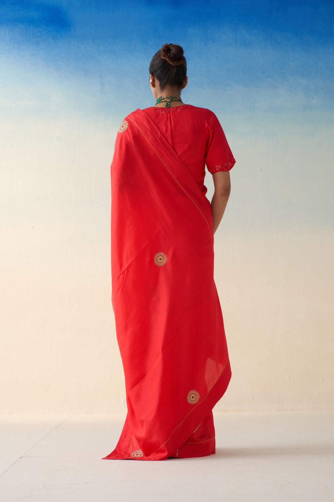 Red silk embroidered motifs saree comes with an organic cotton stitched petticoat (02 Pcs.)