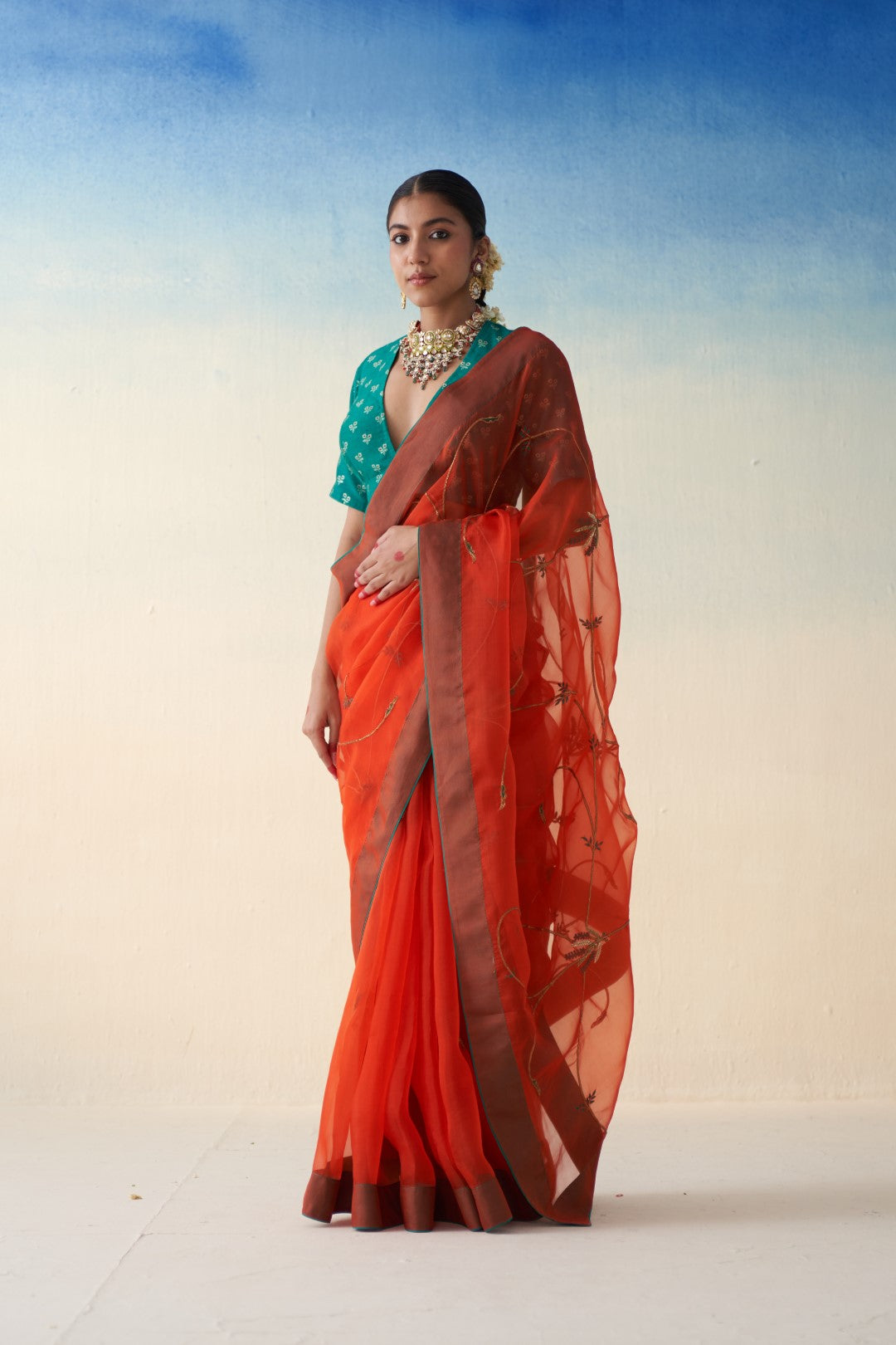 Rust jaal embroidered saree in organza comes with an organic cotton stitched petticoat (02 Pcs.)