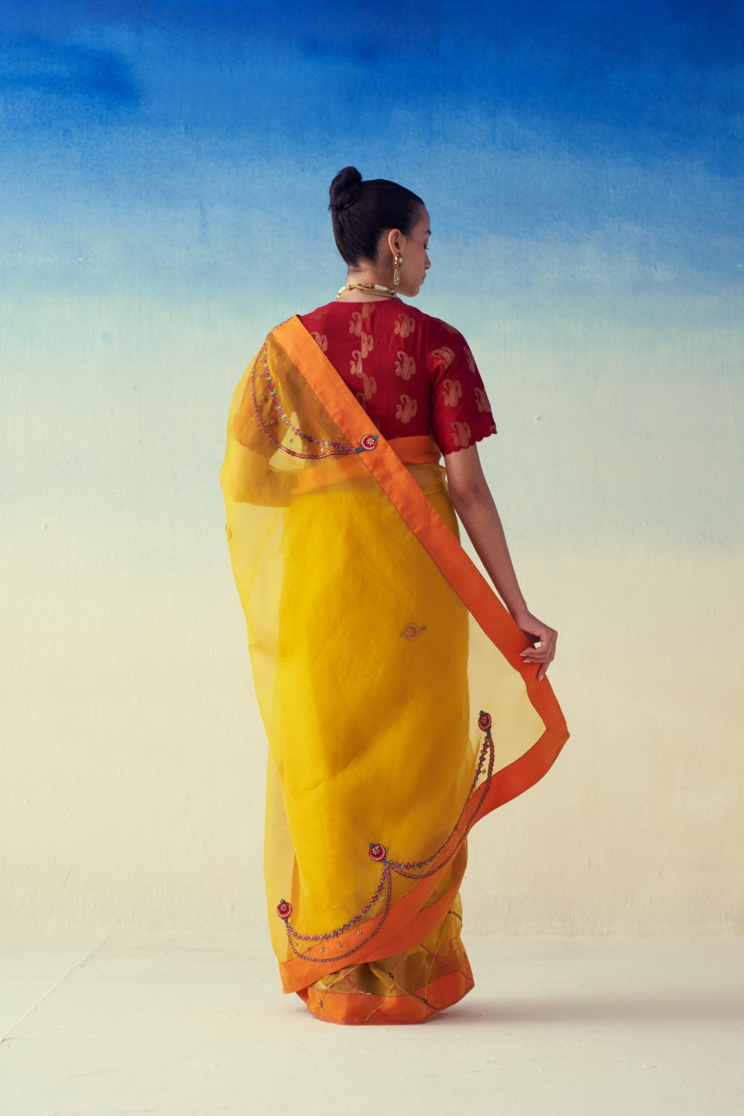 Yellow organza embroidered saree comes with an organic cotton  petticoat (02 Pcs.)