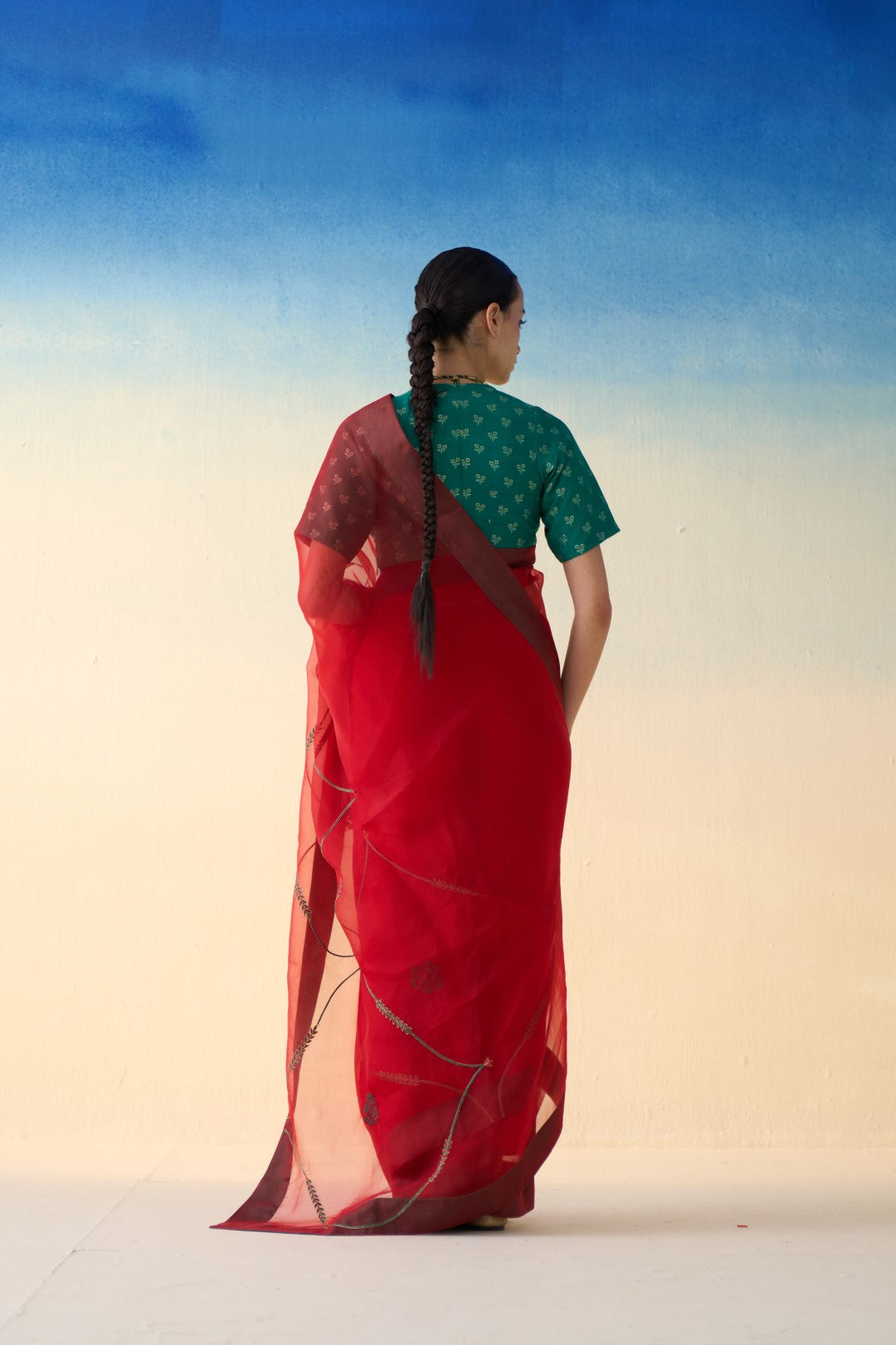 Red jaal embroidered organza saree comes with an organic cotton petticoat (02 Pcs.)