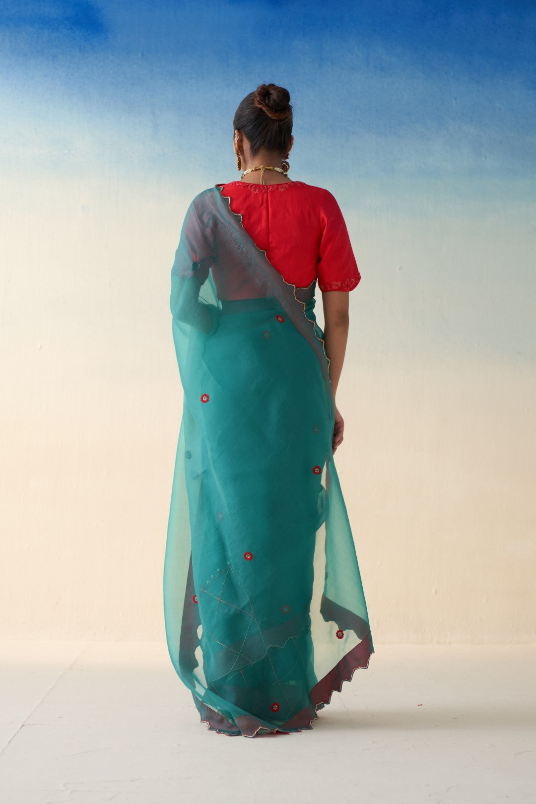 Turquoise organza checkered jaal-embroidered saree comes  with an organic cotton stitched petticoat (02 Pcs.)