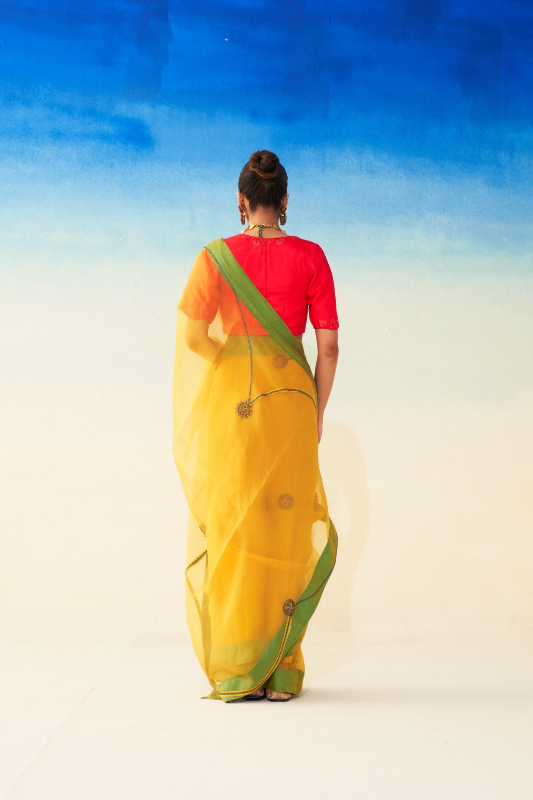 Yellow organza jaal embroidered saree comes with an organic cotton stitched petticoat (02 Pcs.)