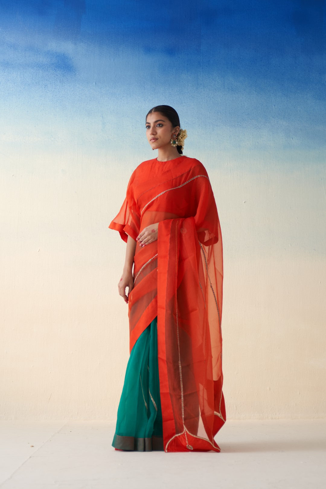 Orange & Green organza embroidered saree comes with an organic cotton stitched petticoat (02 Pcs.)