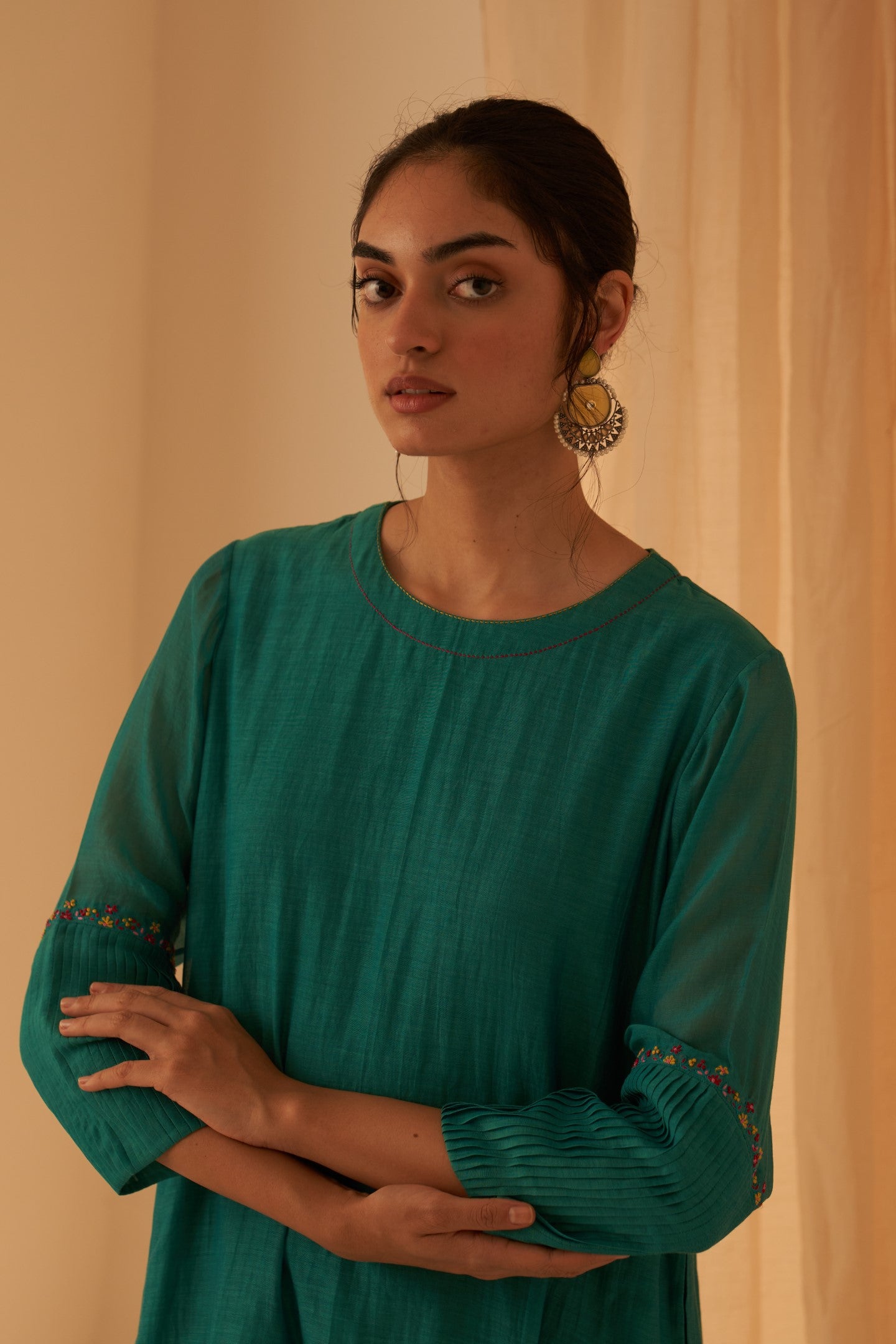 Turquoise chanderi kurta with pintuck box pleats and floral work on sleeves  paired with pant & organza dupatta