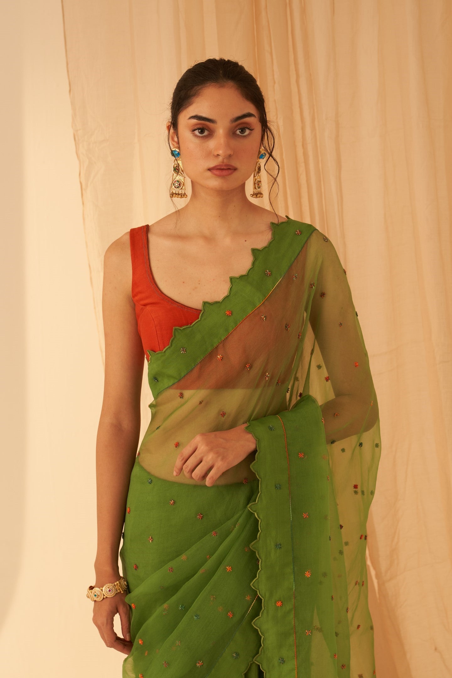 Green Chanderi-organza  embroidered with cross taanka work, scalloped border saree paired with an organic cotton stitched petticoat