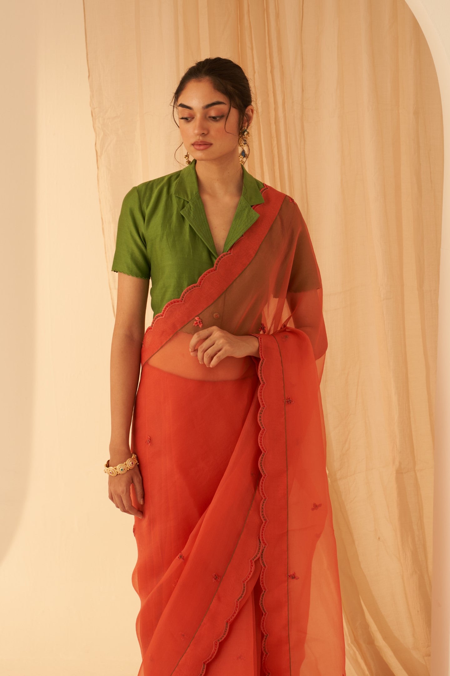 Rust organza allover embroidered butis with beautiful scallop border saree paired with an organic cotton stitched petticoat