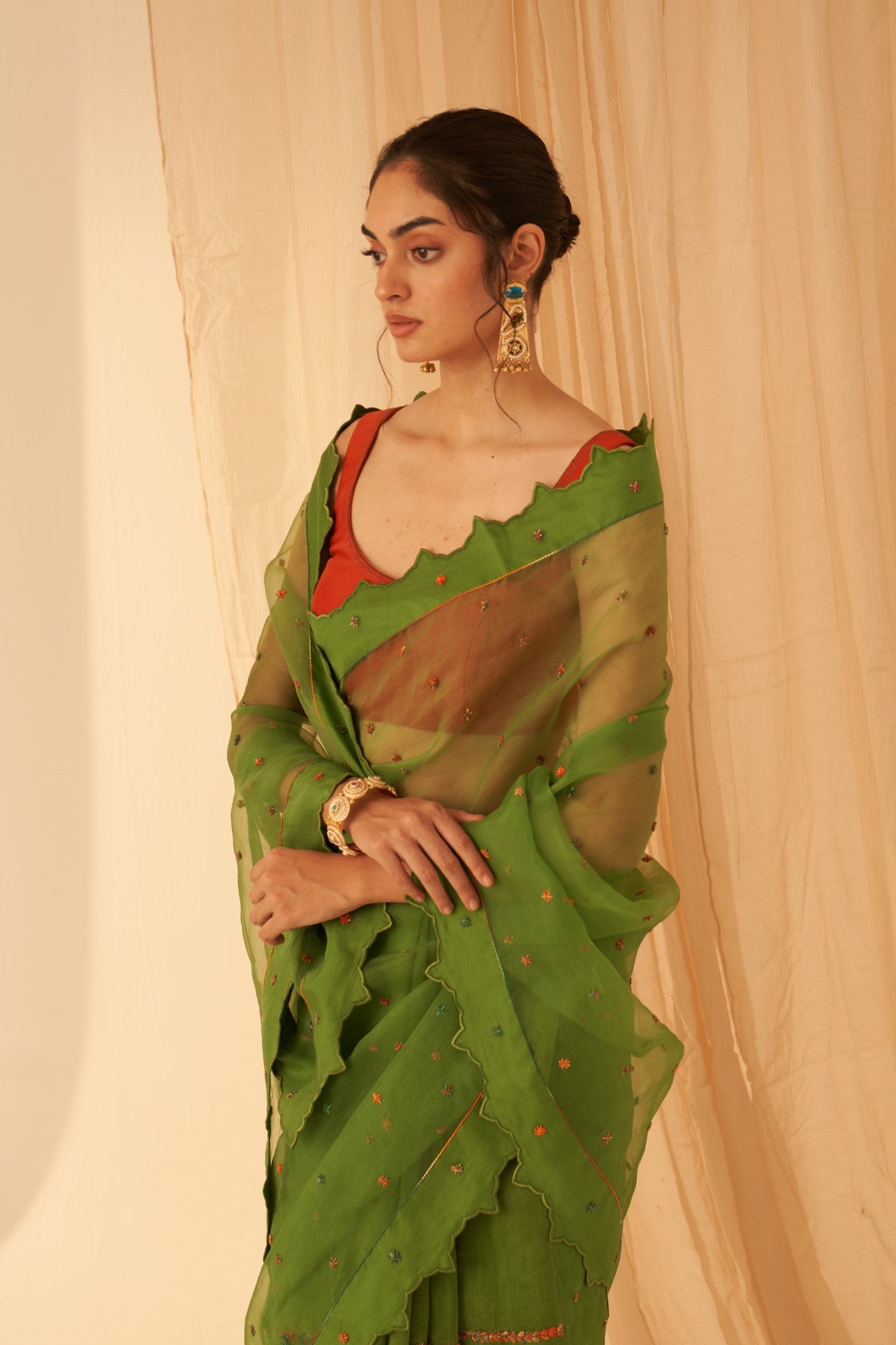 Green Chanderi-organza  embroidered with cross taanka work, scalloped border saree paired with an organic cotton stitched petticoat