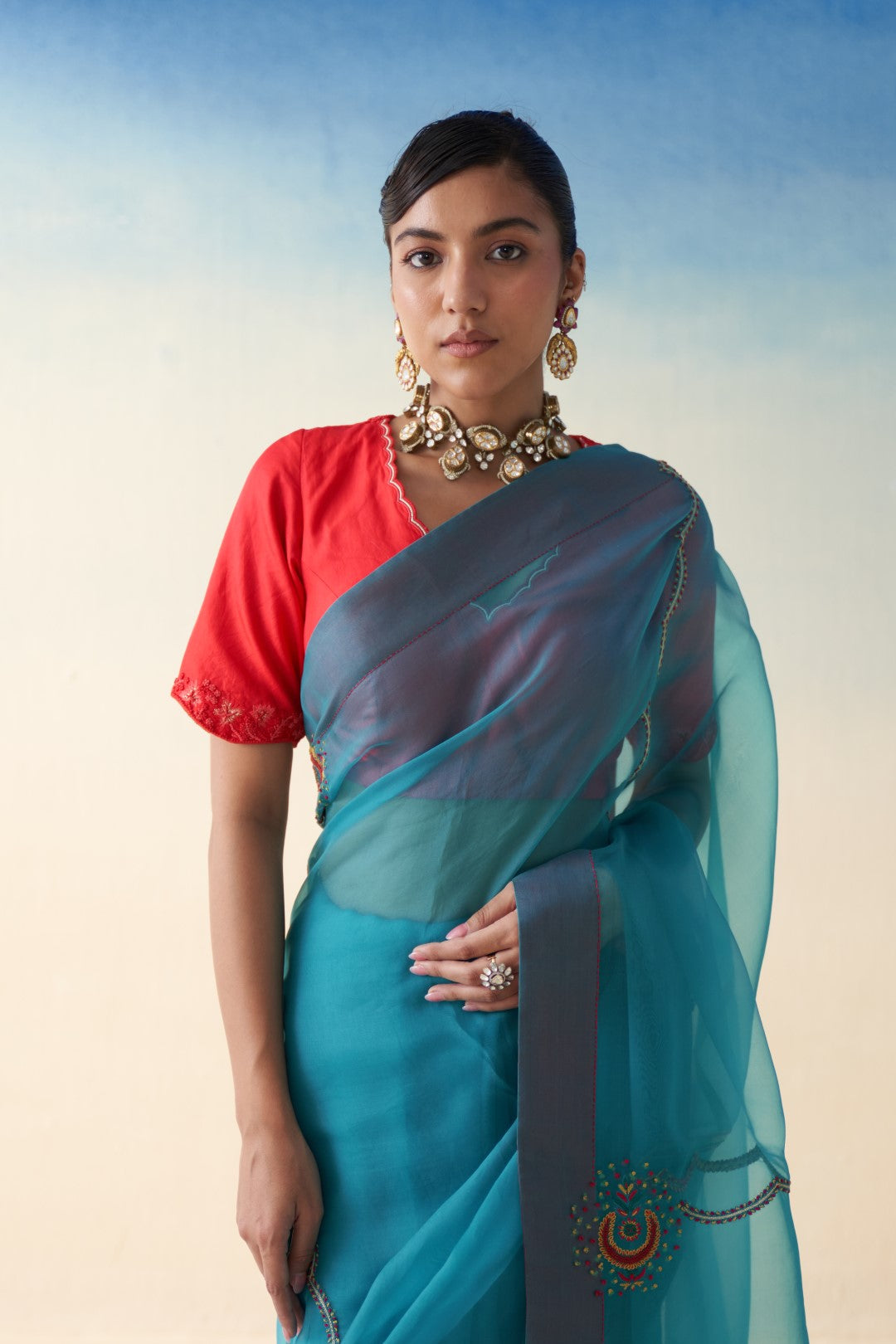 Turquoise organza checkered jaal-embroidered saree comes  with an organic cotton stitched petticoat (02 Pcs.)