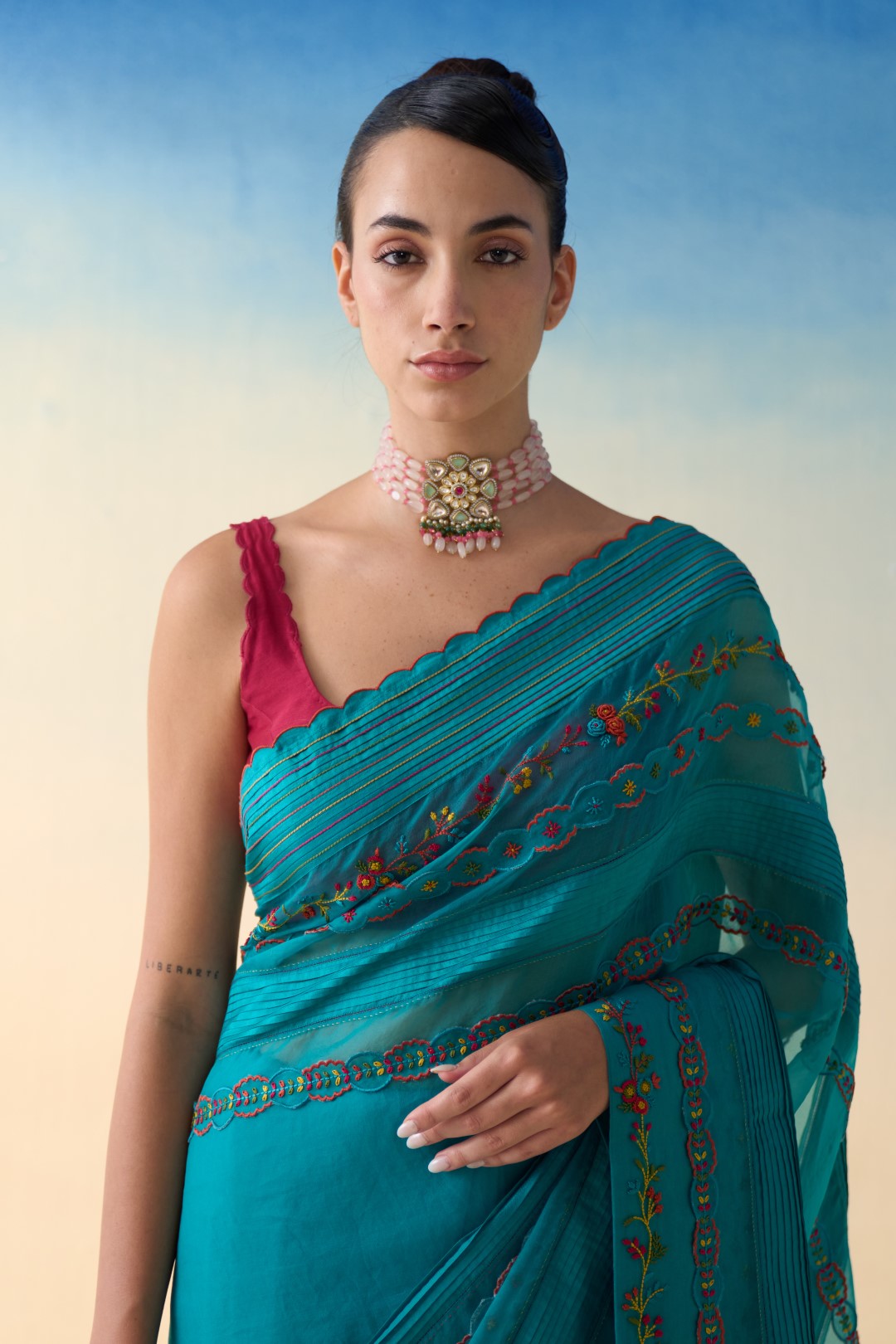 Turquoise silk multicolor embroidered & scallop work saree comes with an organic cotton stitched petticoat ( 02 Pcs.)