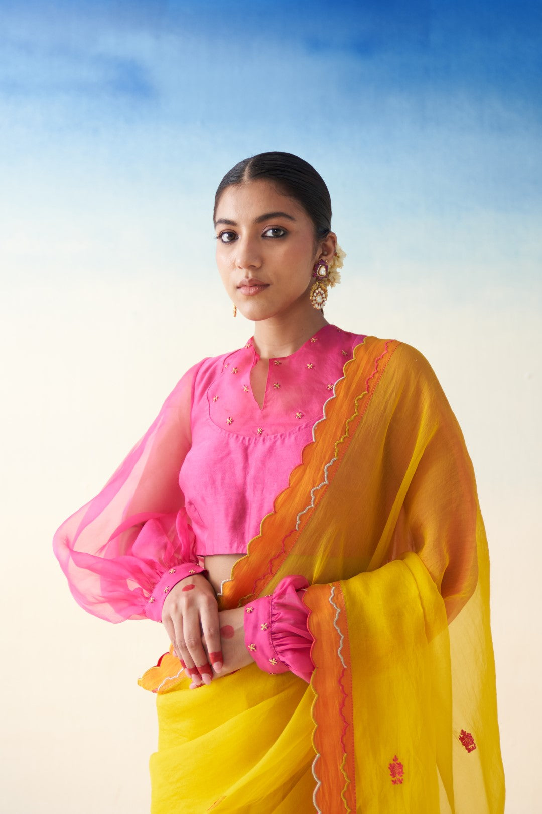 Yellow organza embroidered  scallop border saree comes with an organic cotton stitched petticoat (02 Pcs.)