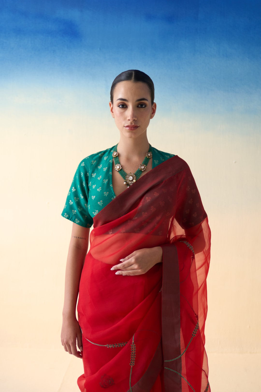 Red jaal embroidered organza saree comes with an organic cotton petticoat (02 Pcs.)