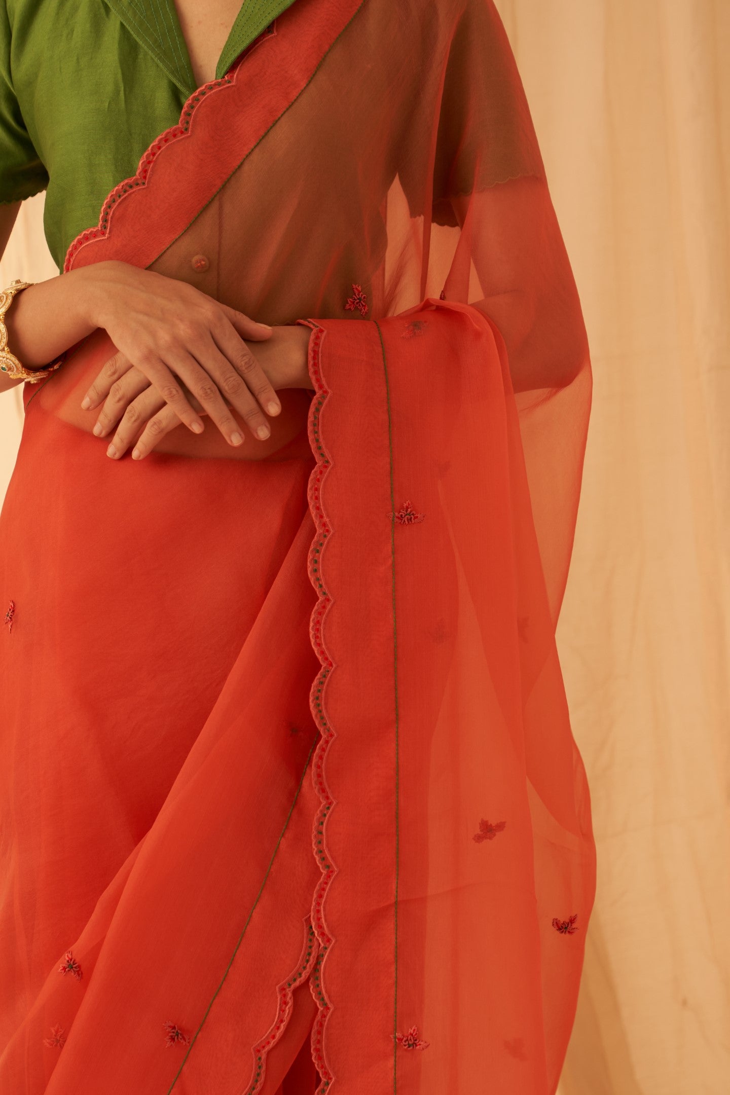 Rust organza allover embroidered butis with beautiful scallop border saree paired with an organic cotton stitched petticoat