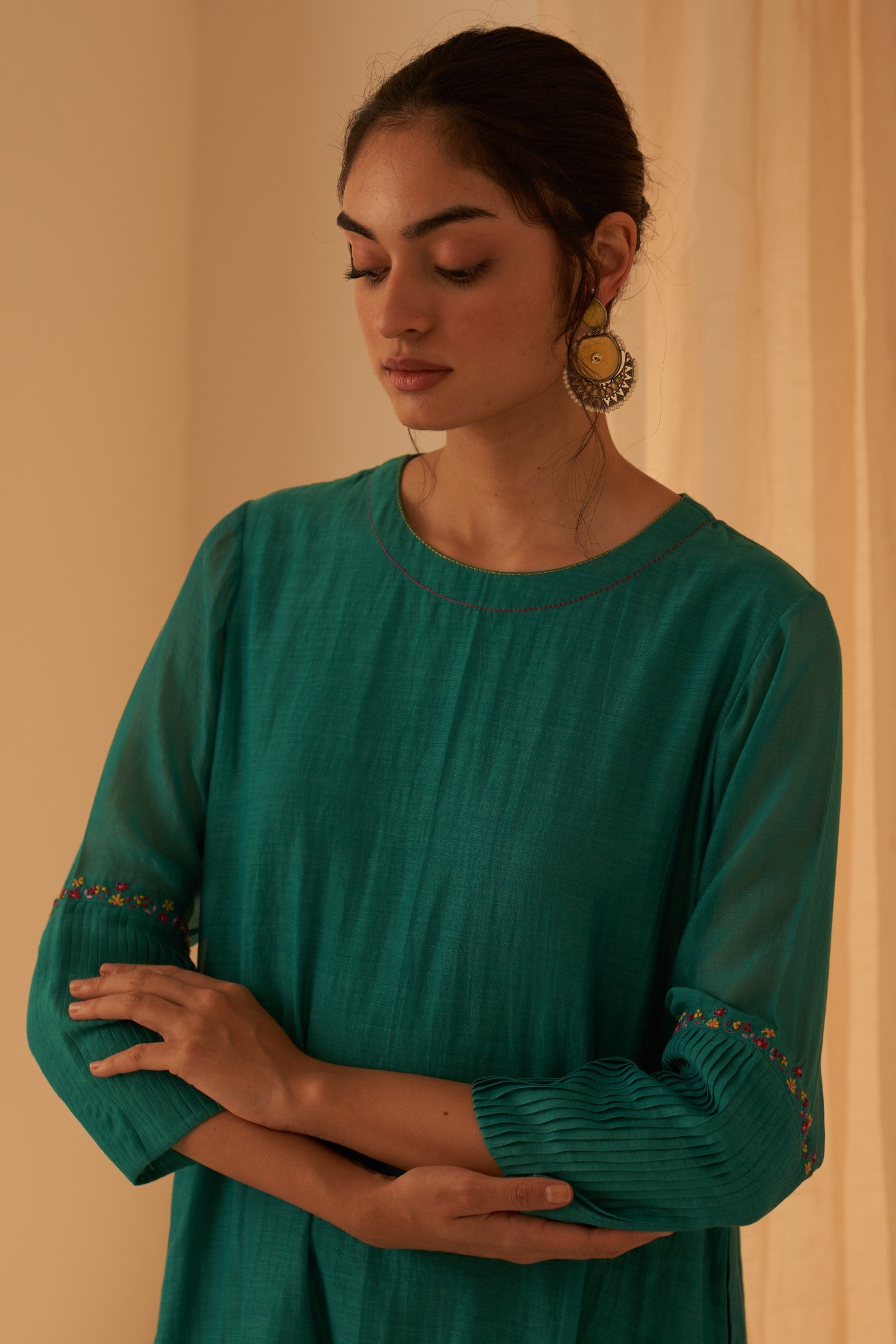 Turquoise chanderi kurta with pintuck box pleats and floral work on sleeves  paired with pant & organza dupatta