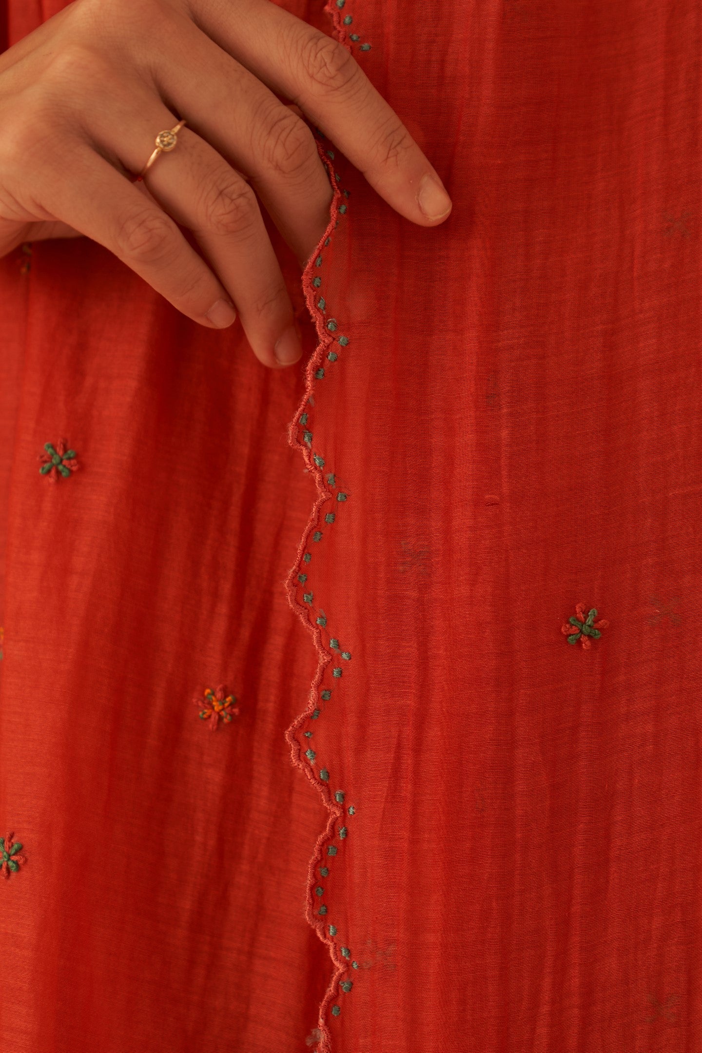 Rust chanderi cross stitch embroidered kurta paired with cotton slip, pant & chanderi dupatta