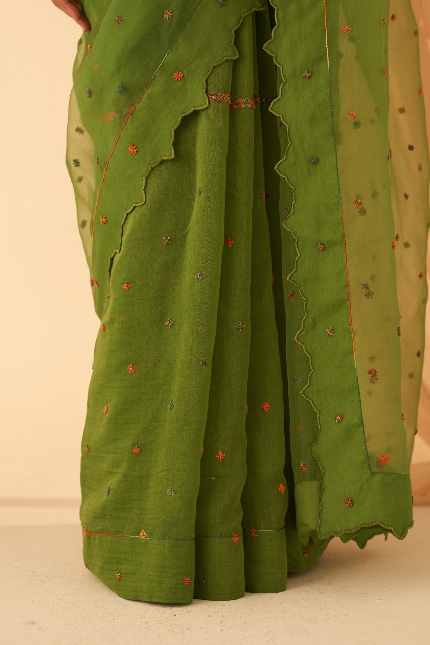 Green Chanderi-organza  embroidered with cross taanka work, scalloped border saree paired with an organic cotton stitched petticoat