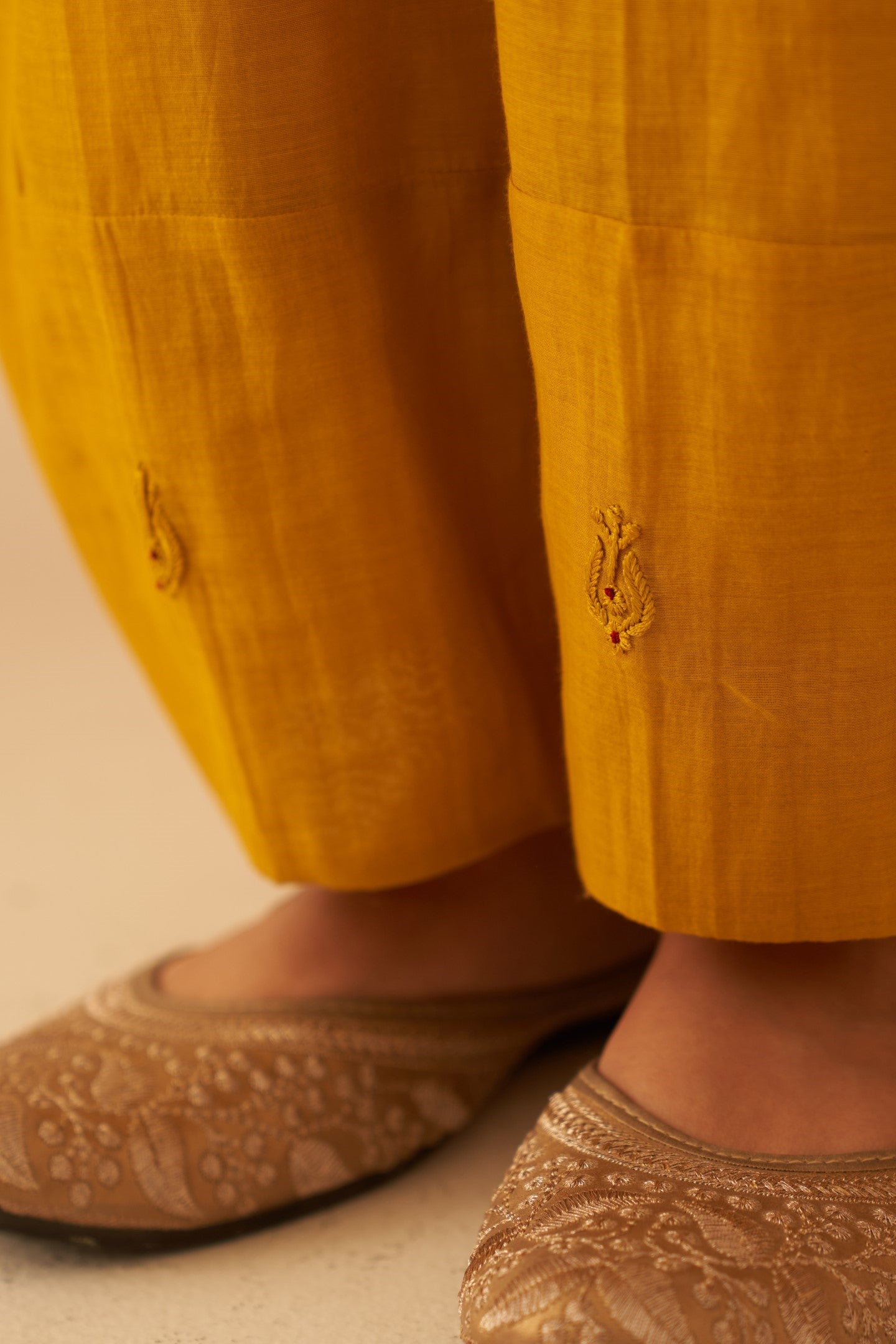 Mustard Chanderi resham buti embroidered tumic paired with cotton slip & Salwar