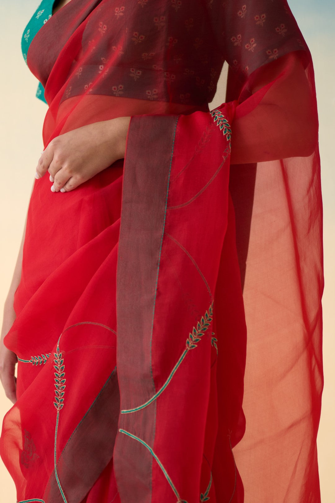 Red jaal embroidered organza saree comes with an organic cotton petticoat (02 Pcs.)