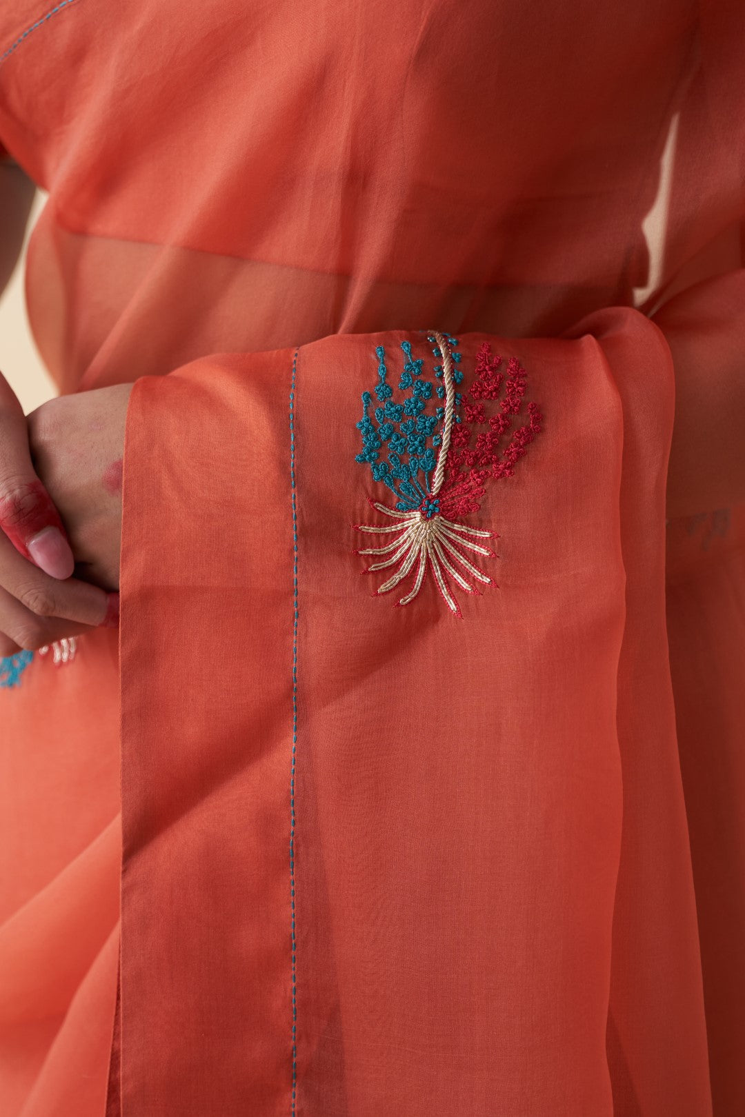 Rust organza motifs embroidered saree comes with an organic cotton stitched petticoat (02 Pcs.)