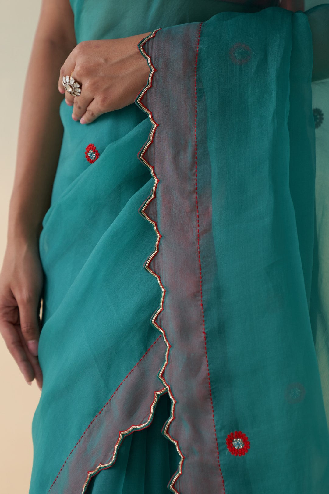 Turquoise organza checkered jaal-embroidered saree comes  with an organic cotton stitched petticoat (02 Pcs.)