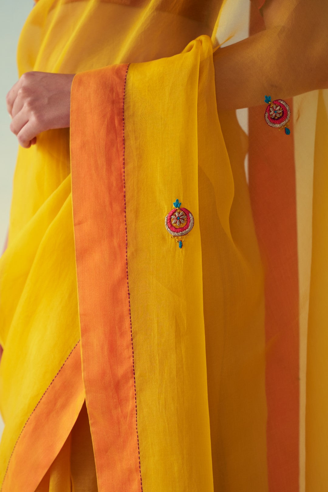 Yellow organza embroidered saree comes with an organic cotton  petticoat (02 Pcs.)