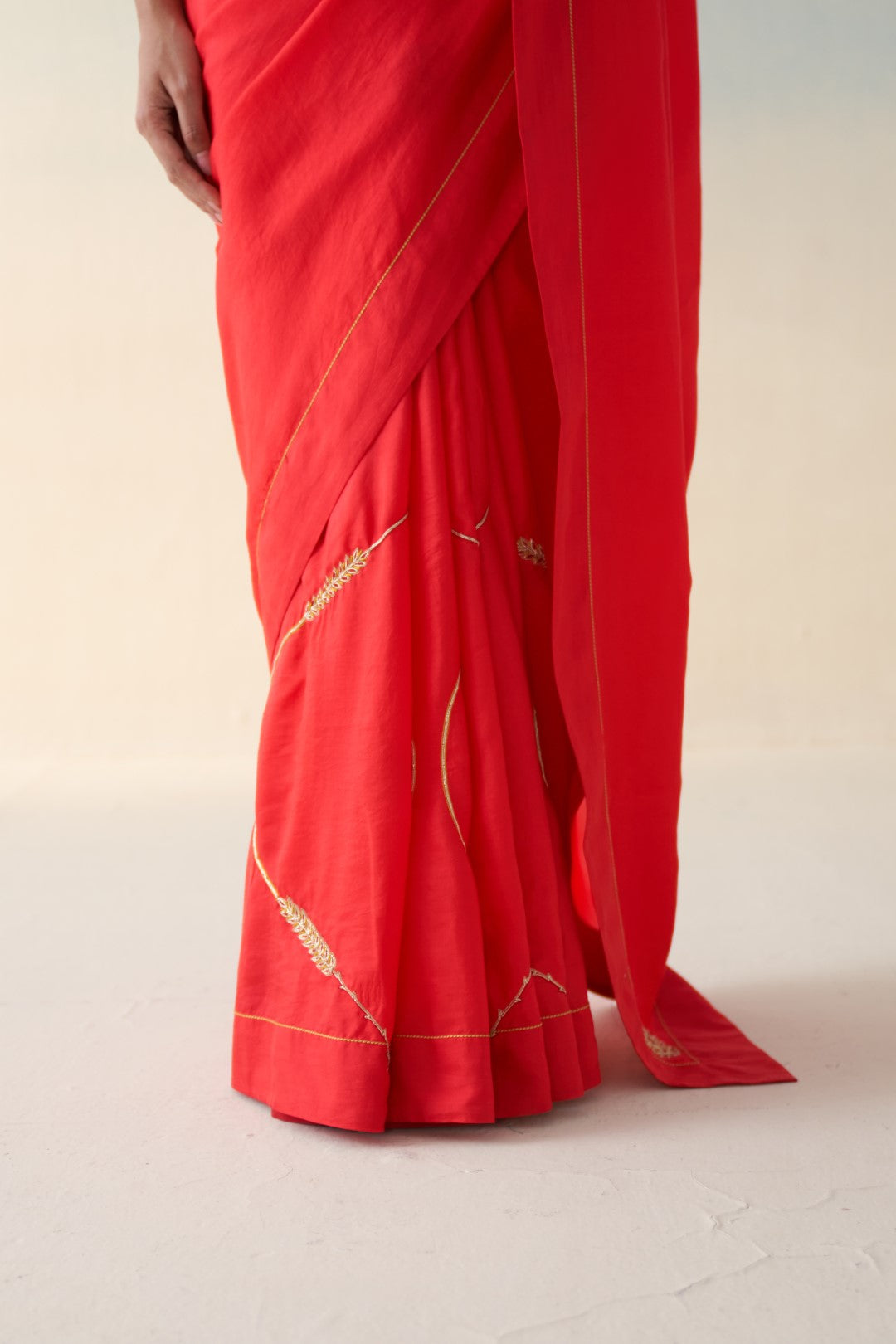 Red silk embroidered motifs saree comes with an organic cotton stitched petticoat (02 Pcs.)